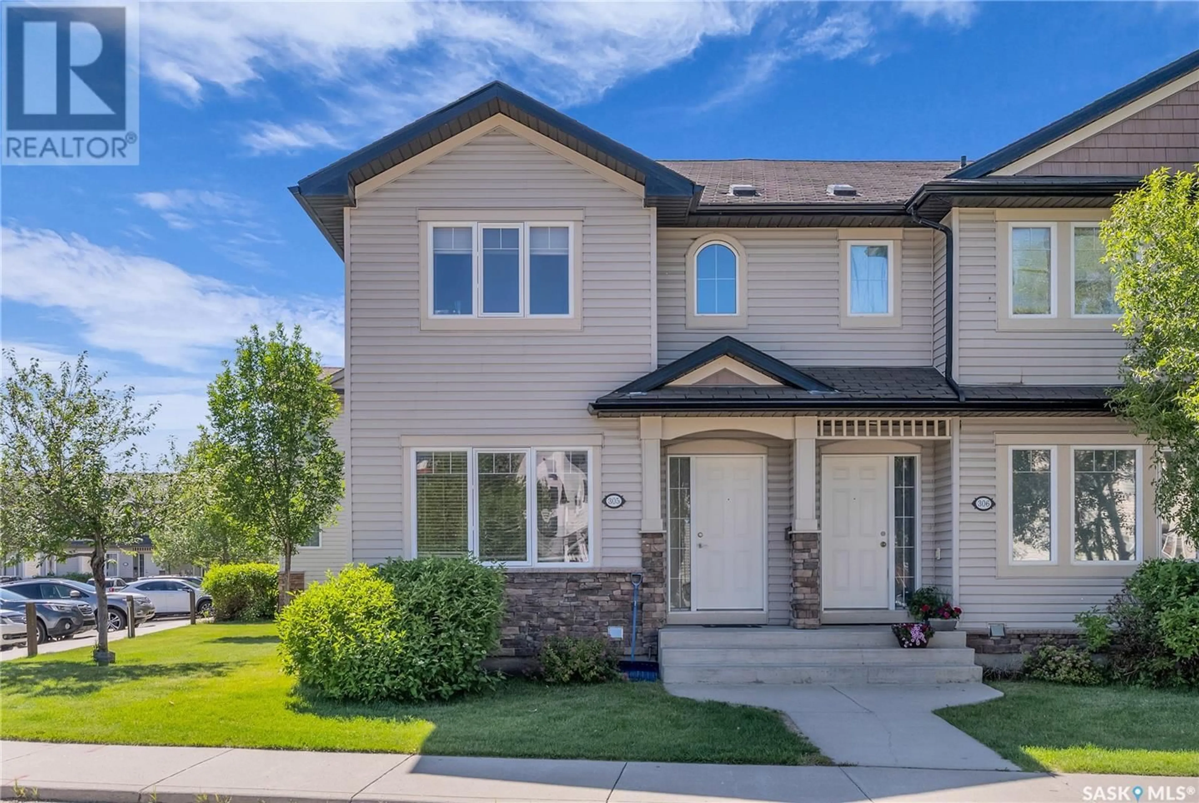 Home with vinyl exterior material, street for 303 - 305 SLIMMON PLACE, Saskatoon Saskatchewan S7V0A8
