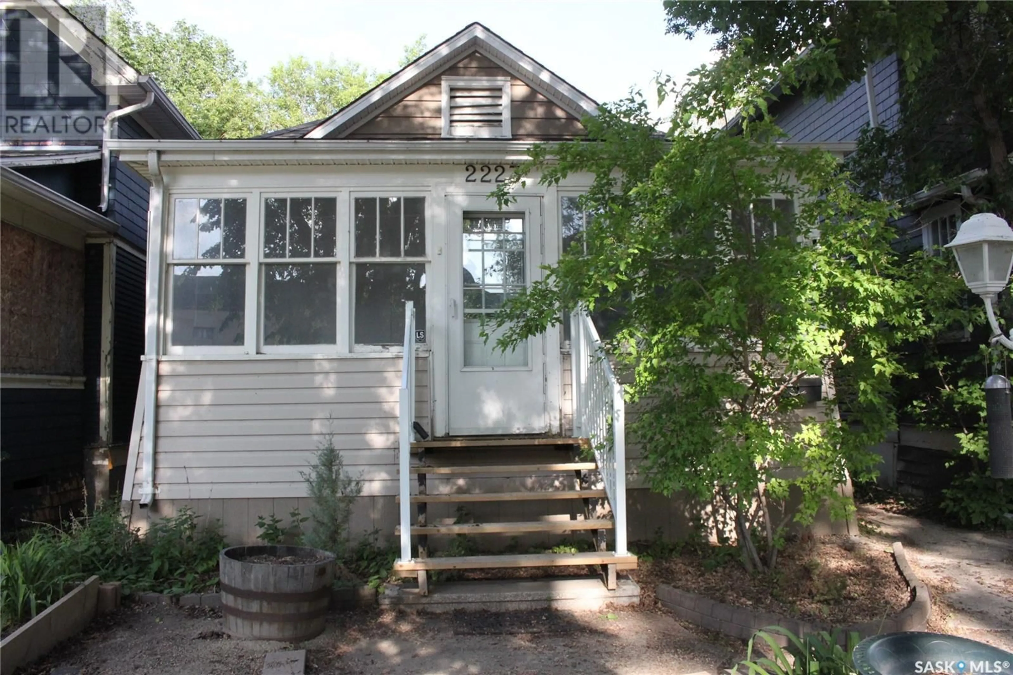Home with vinyl exterior material, street for 2223 TORONTO STREET, Regina Saskatchewan S4P1N5