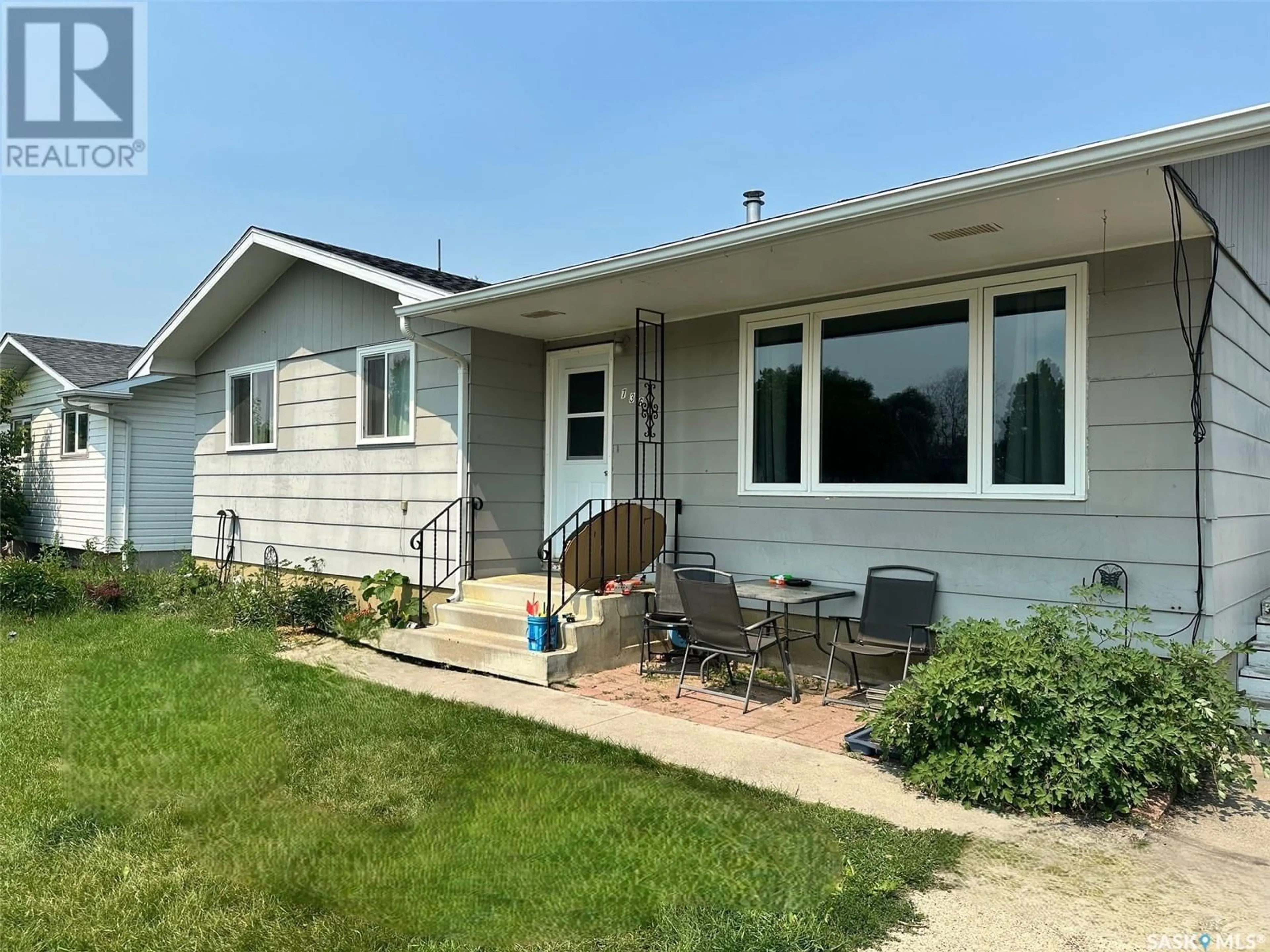 Home with vinyl exterior material, street for 736 HUDSON CRESCENT, Hudson Bay Saskatchewan S0E0Y0