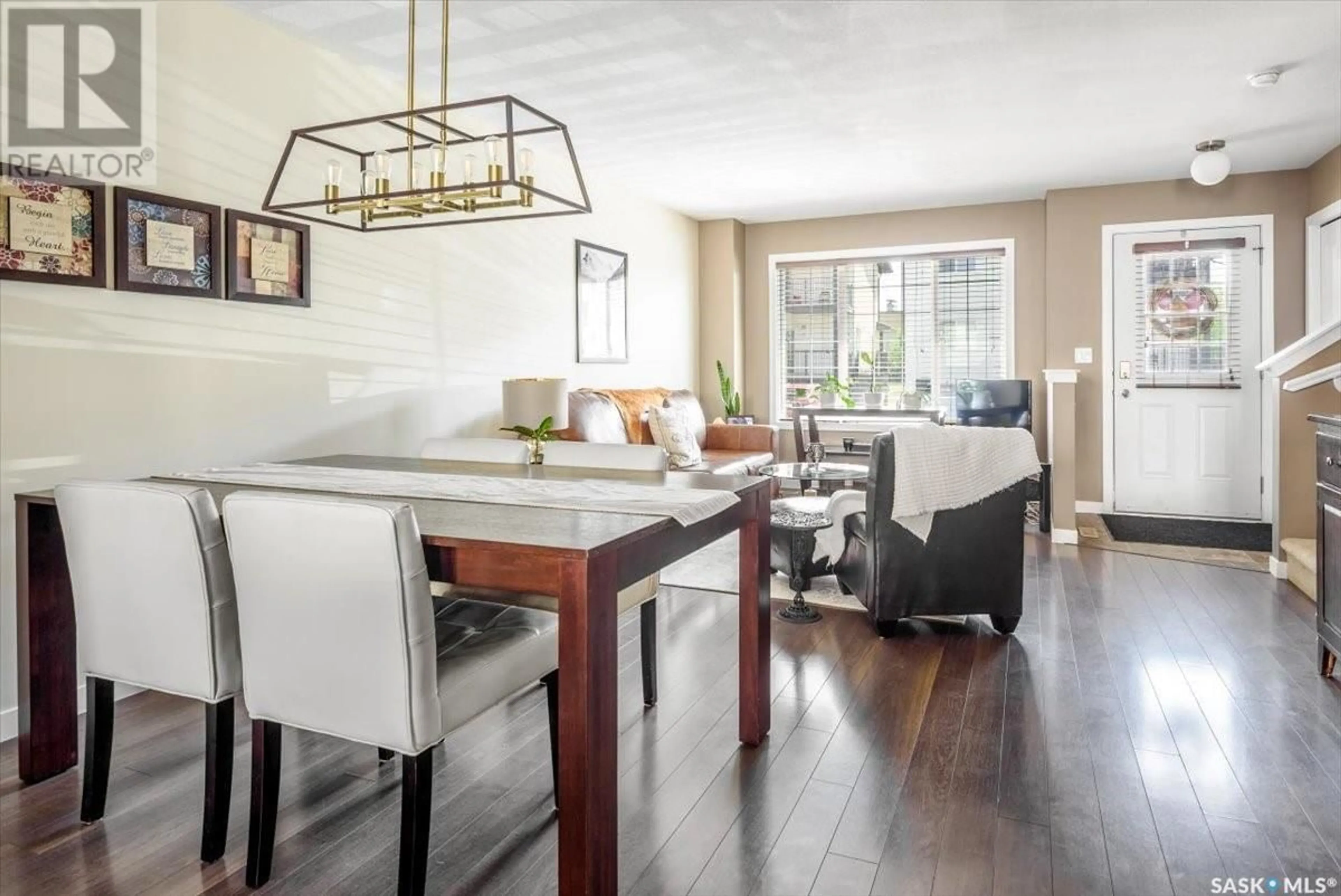 Open concept kitchen, wood/laminate floor for 56 4640 HARBOUR LANDING DRIVE, Regina Saskatchewan S4W0B8