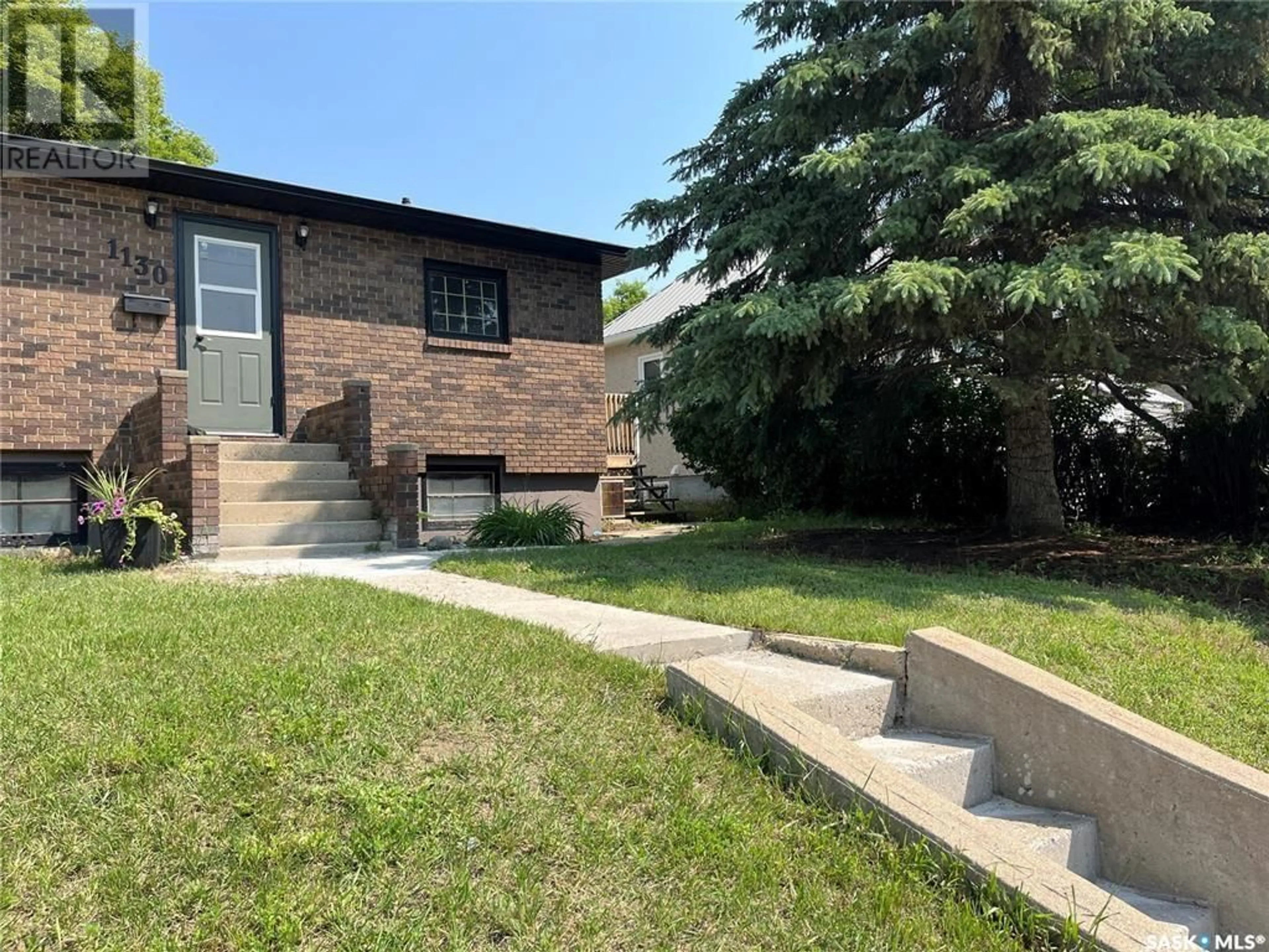 Home with brick exterior material, street for 1130 ATHABASCA STREET, Moose Jaw Saskatchewan S6H2E7