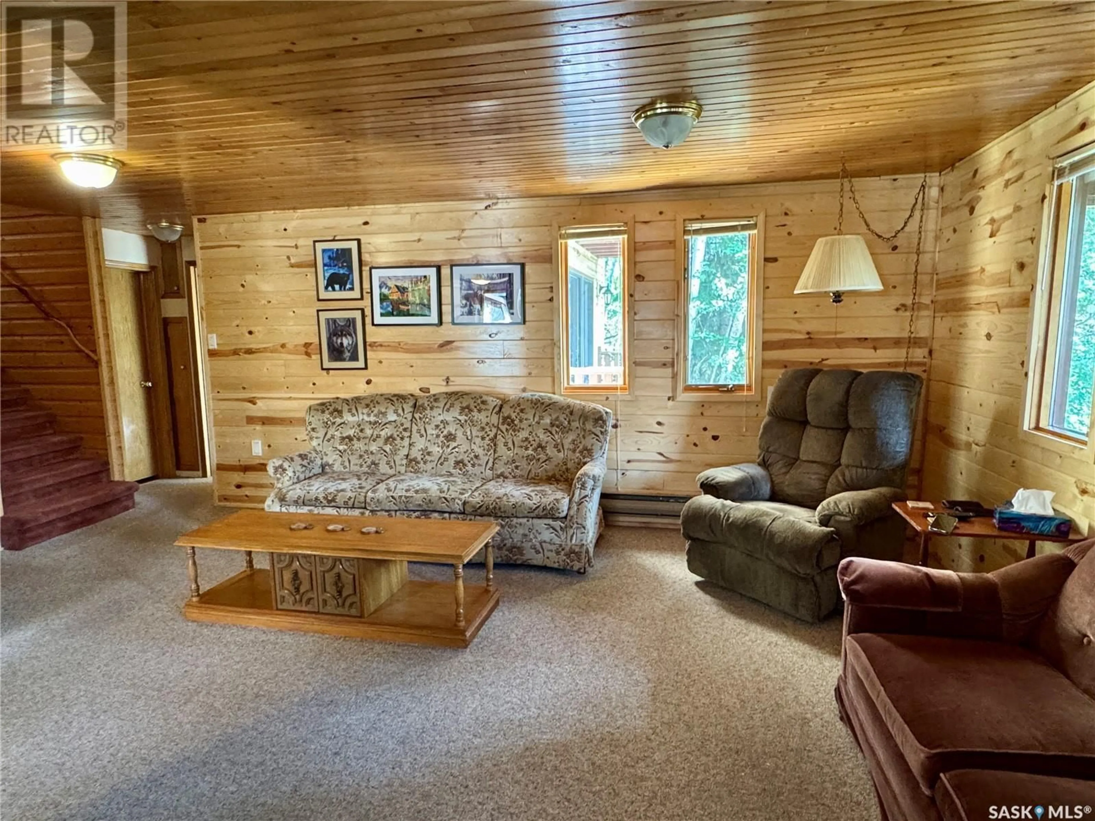Living room with furniture, wood/laminate floor for 1605 WILLOW STREET, Northern Admin District Saskatchewan S0J1L0
