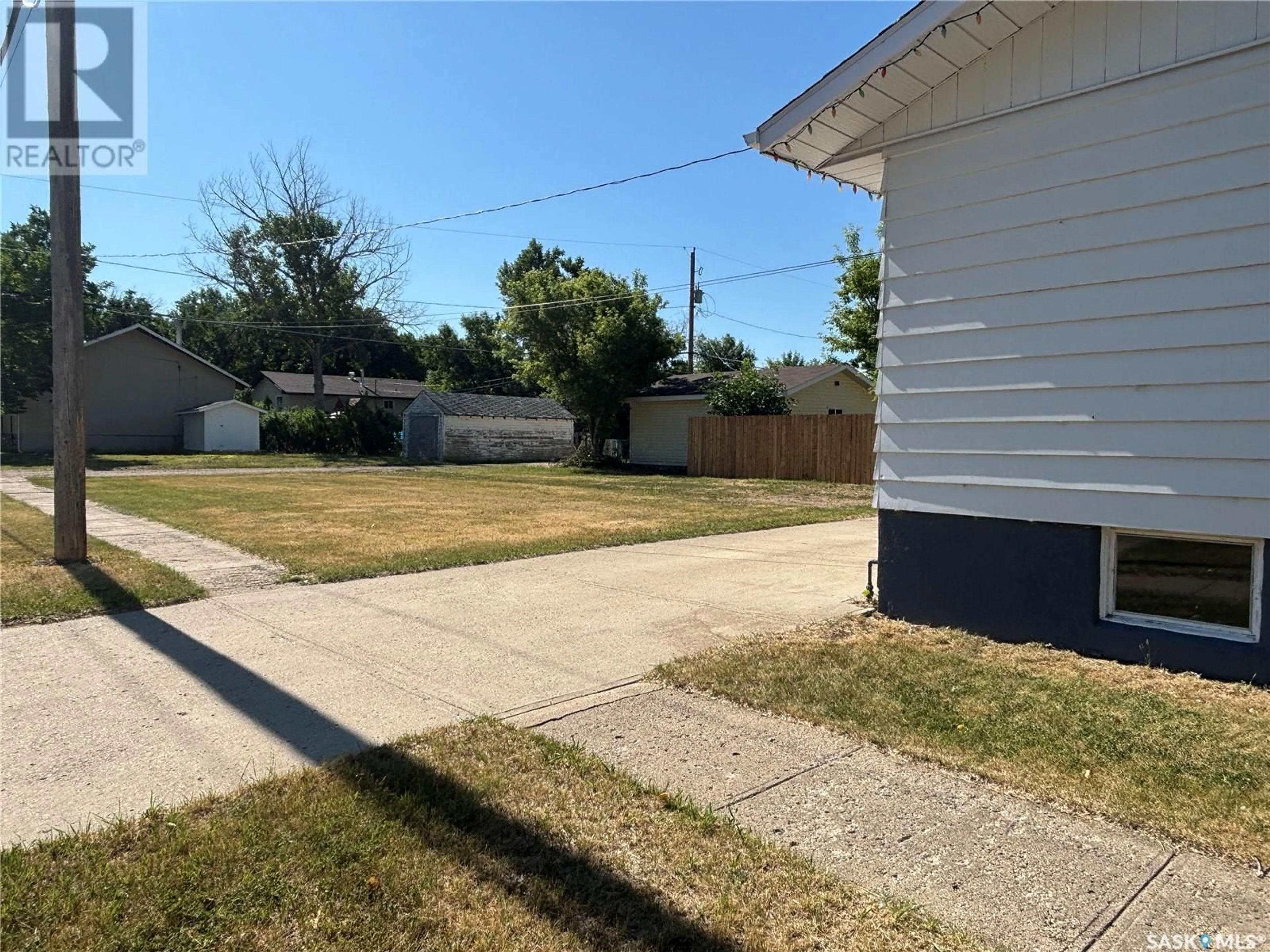 A pic from outside/outdoor area/front of a property/back of a property/a pic from drone, street for 502 JASPER STREET, Maple Creek Saskatchewan S0N1N0