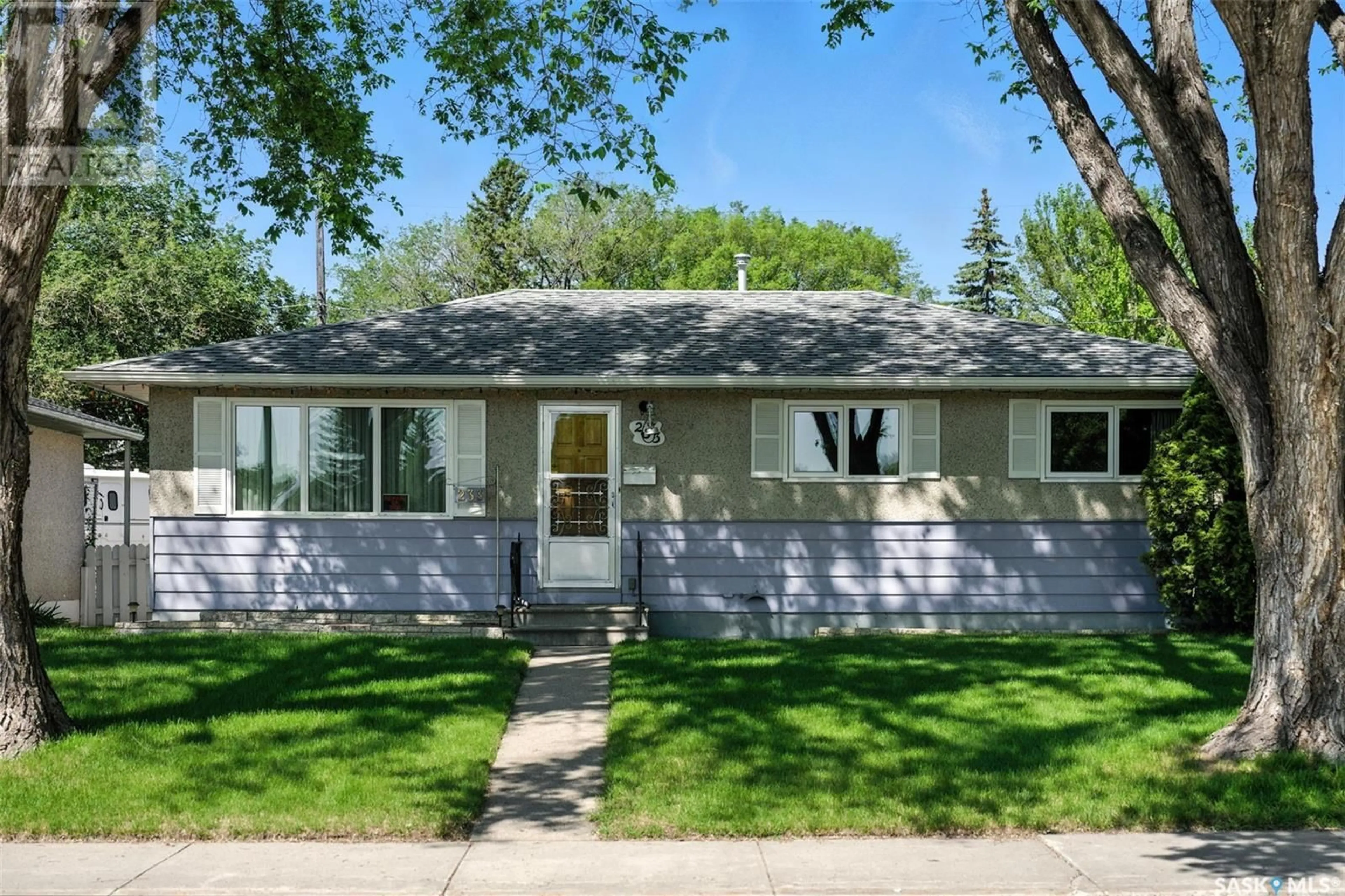 Home with vinyl exterior material, street for 233 OTTAWA AVENUE, Saskatoon Saskatchewan S7L3N9