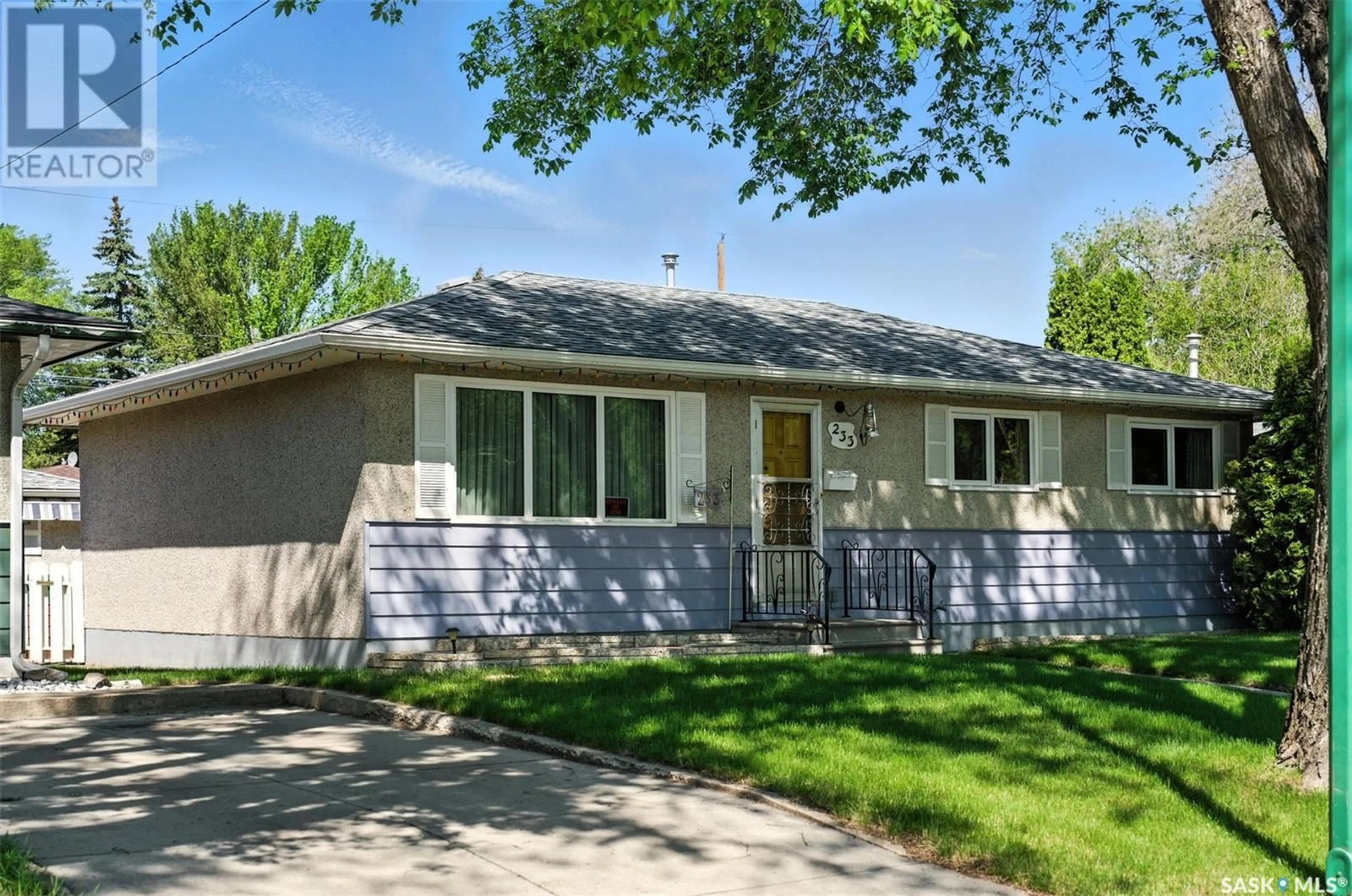 Home with vinyl exterior material, street for 233 OTTAWA AVENUE, Saskatoon Saskatchewan S7L3N9