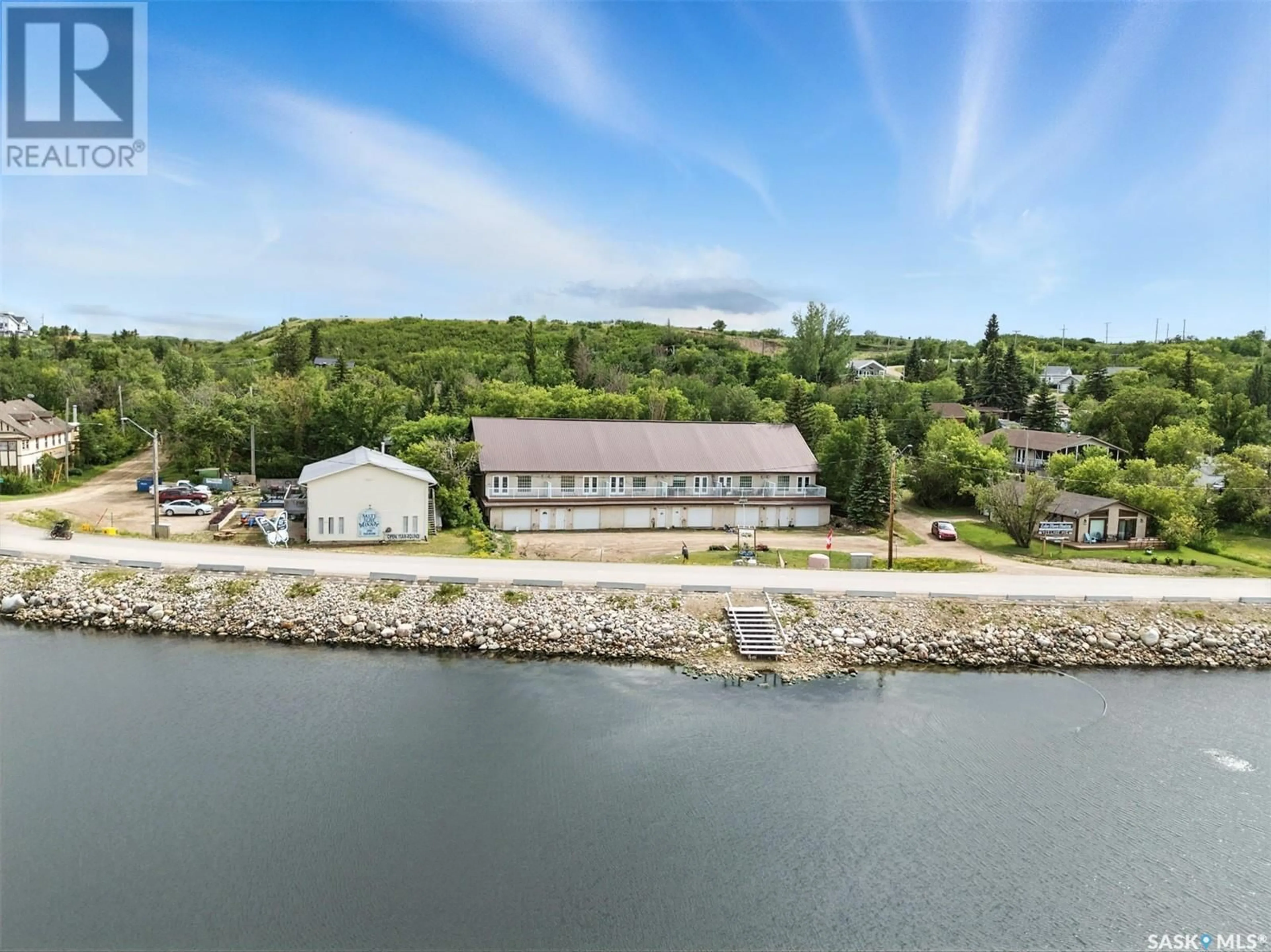 A pic from outside/outdoor area/front of a property/back of a property/a pic from drone, water/lake/river/ocean view for 6 412 LAKE AVENUE, Manitou Beach Saskatchewan S0K4T1