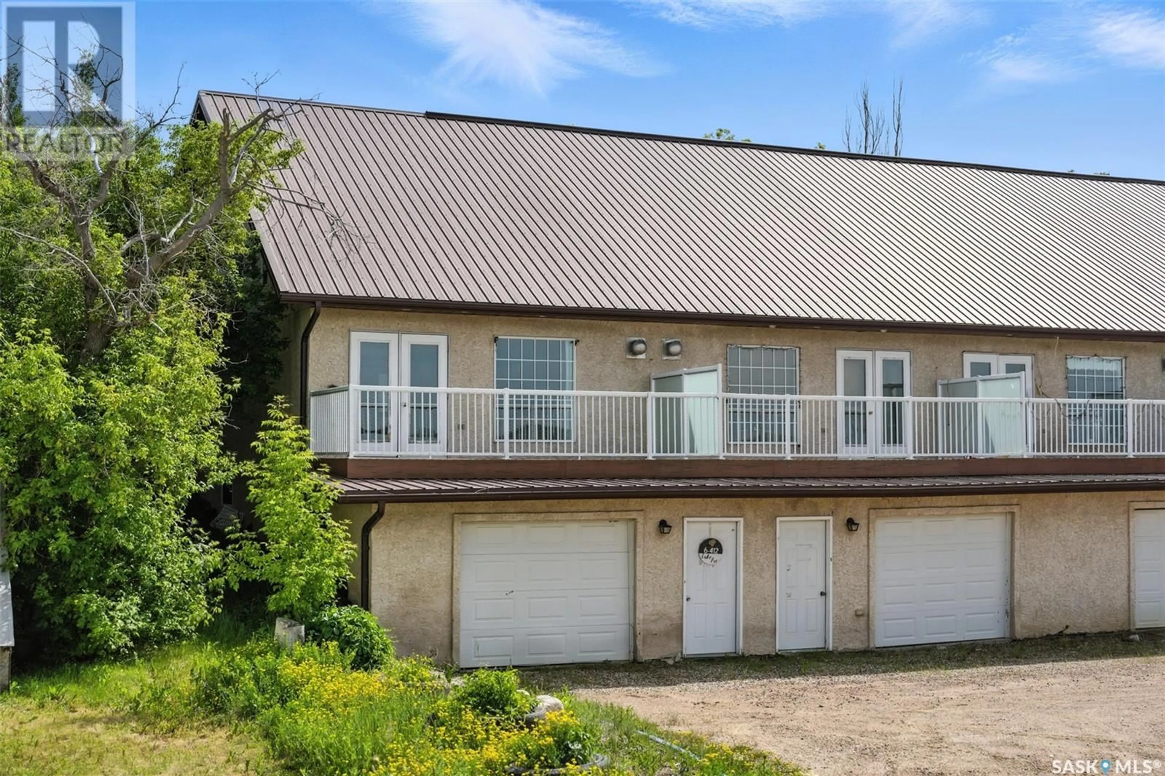 A pic from outside/outdoor area/front of a property/back of a property/a pic from drone, building for 6 412 LAKE AVENUE, Manitou Beach Saskatchewan S0K4T1