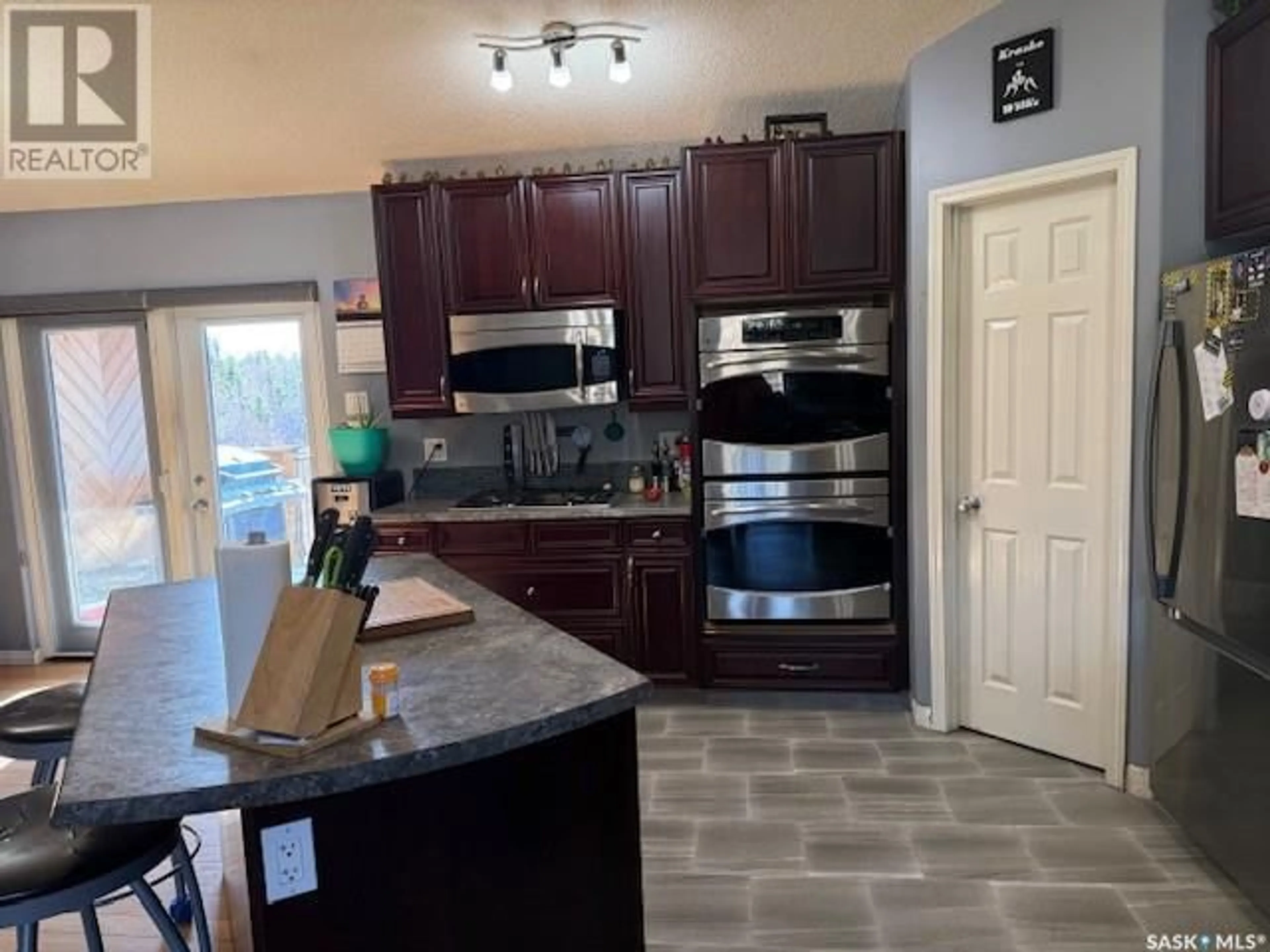 Open concept kitchen, ceramic/tile floor for 1303 STUDER STREET, La Ronge Saskatchewan S0J1L0