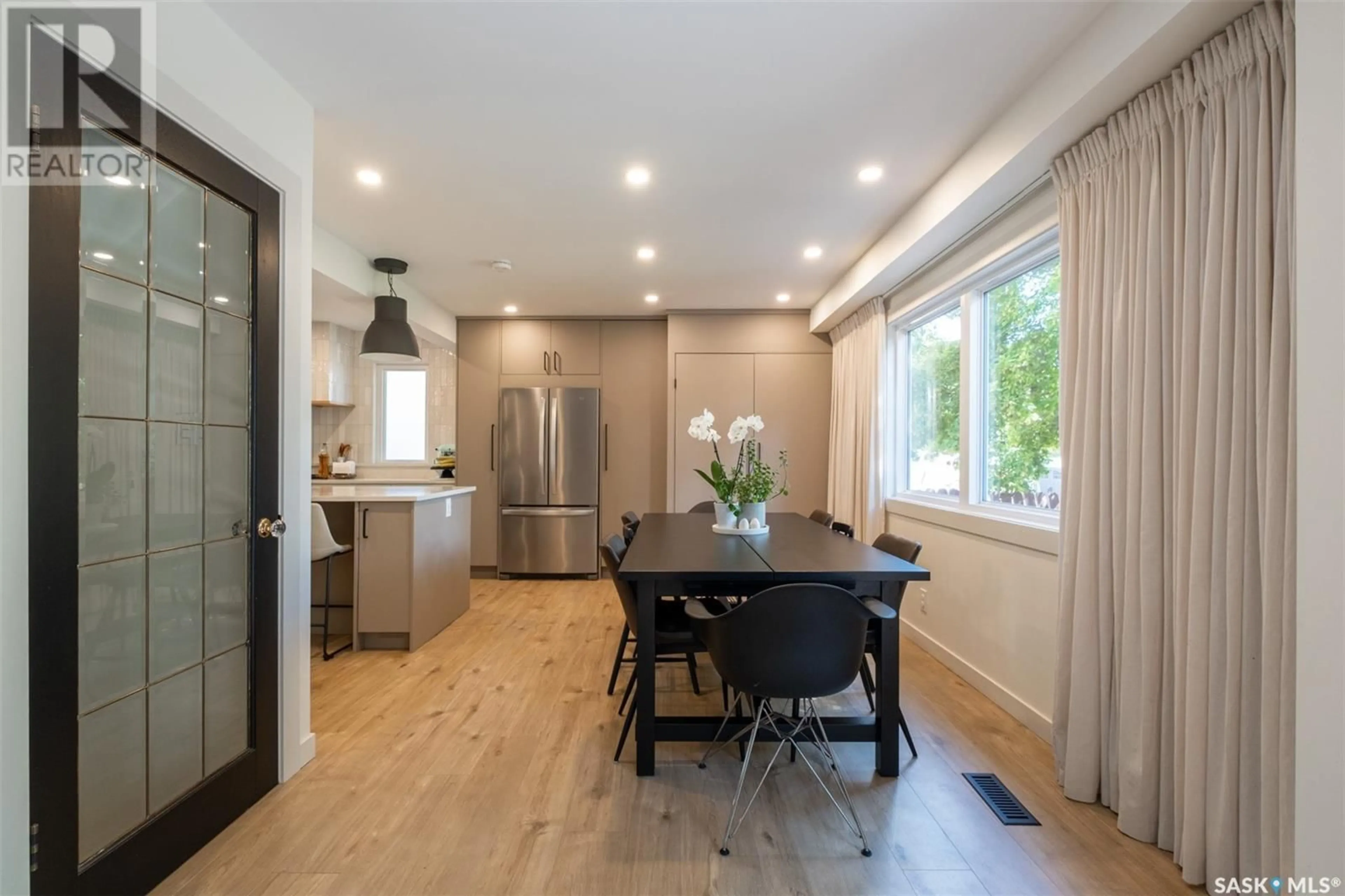 Open concept kitchen, wood/laminate floor for 114 METCALFE ROAD, Regina Saskatchewan S4V0H8