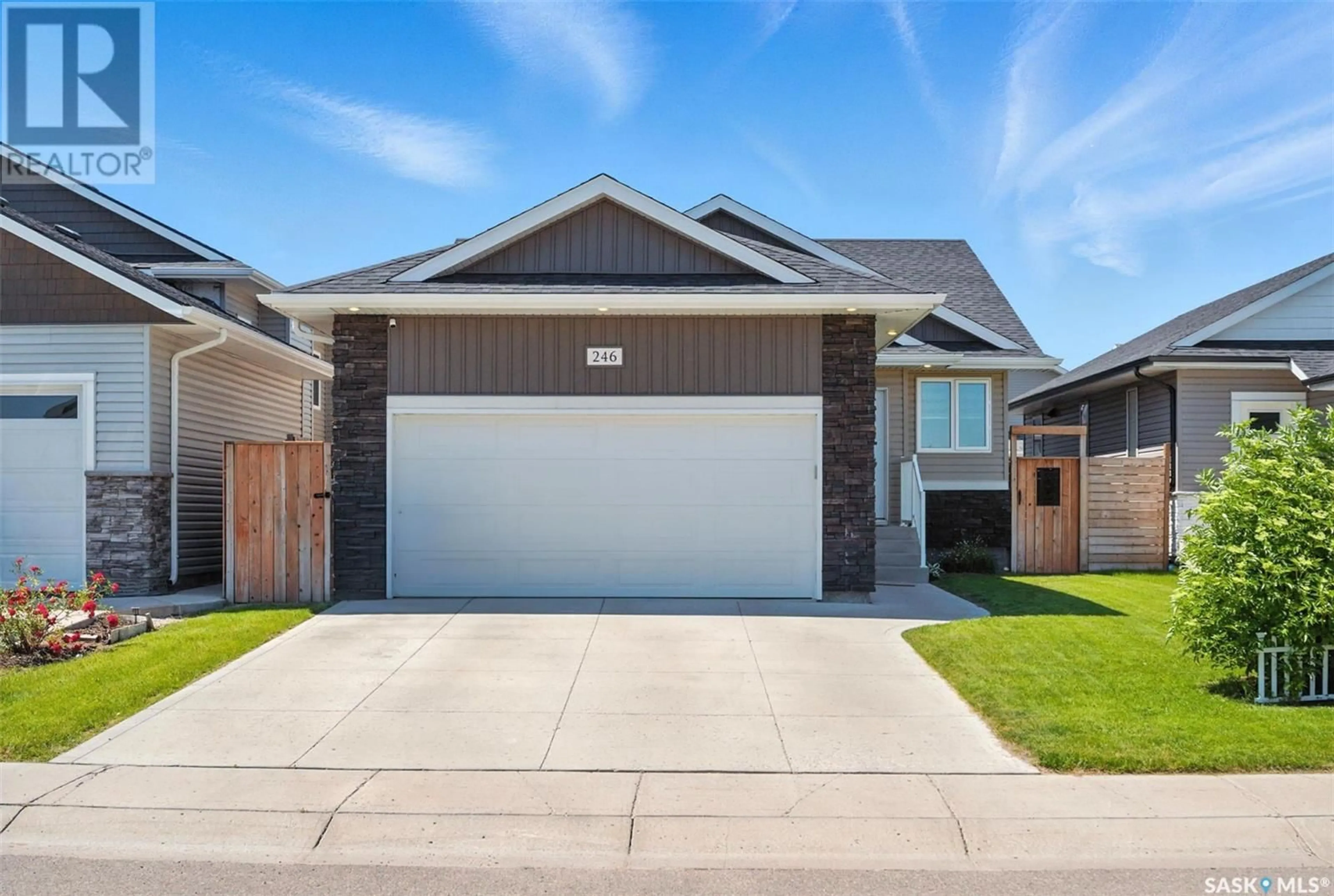 Home with brick exterior material, street for 246 HASSARD CLOSE, Saskatoon Saskatchewan S7L4Z7