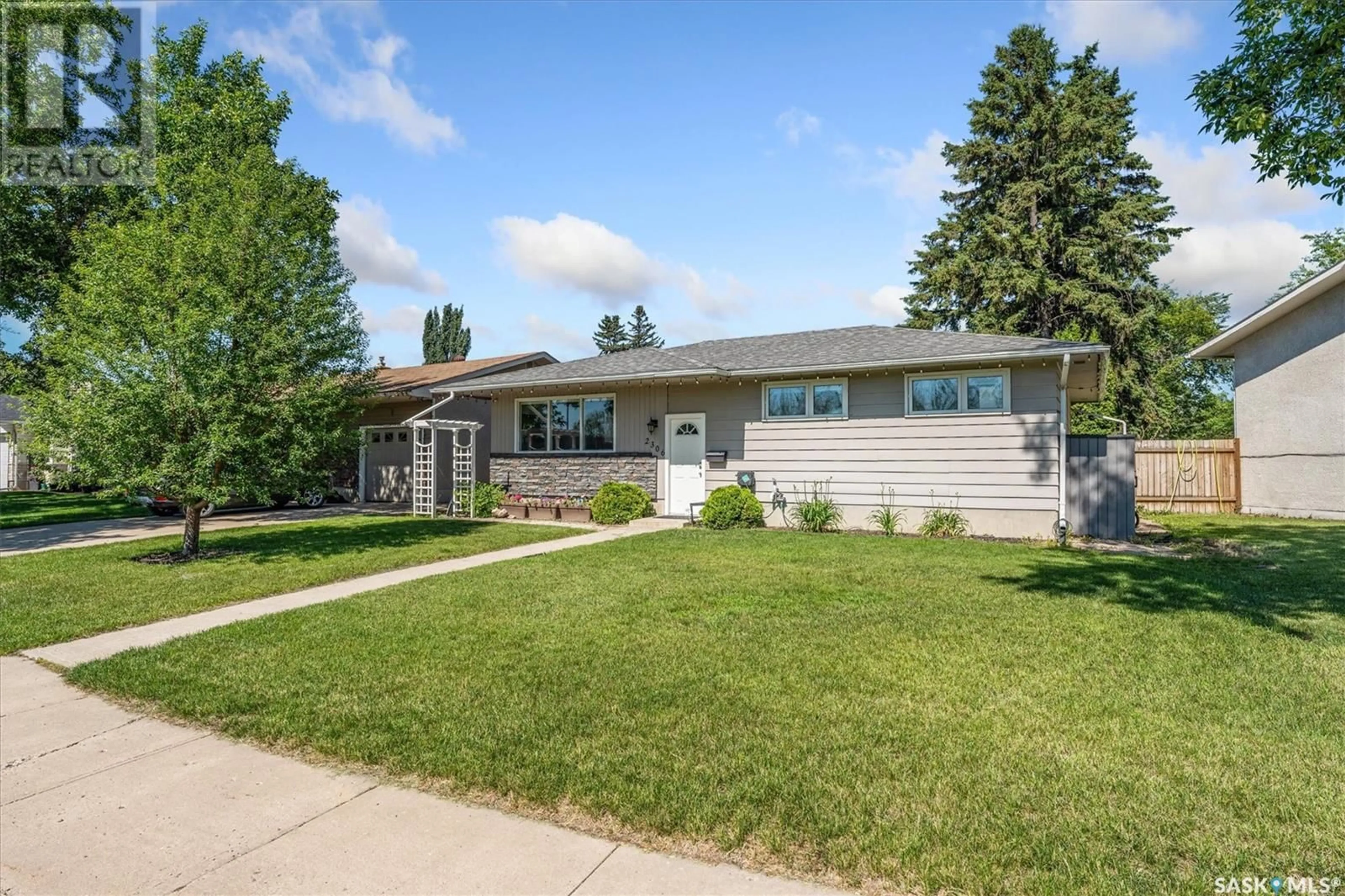 Home with vinyl exterior material, street for 2306 EASTHILL, Saskatoon Saskatchewan S7J3E5