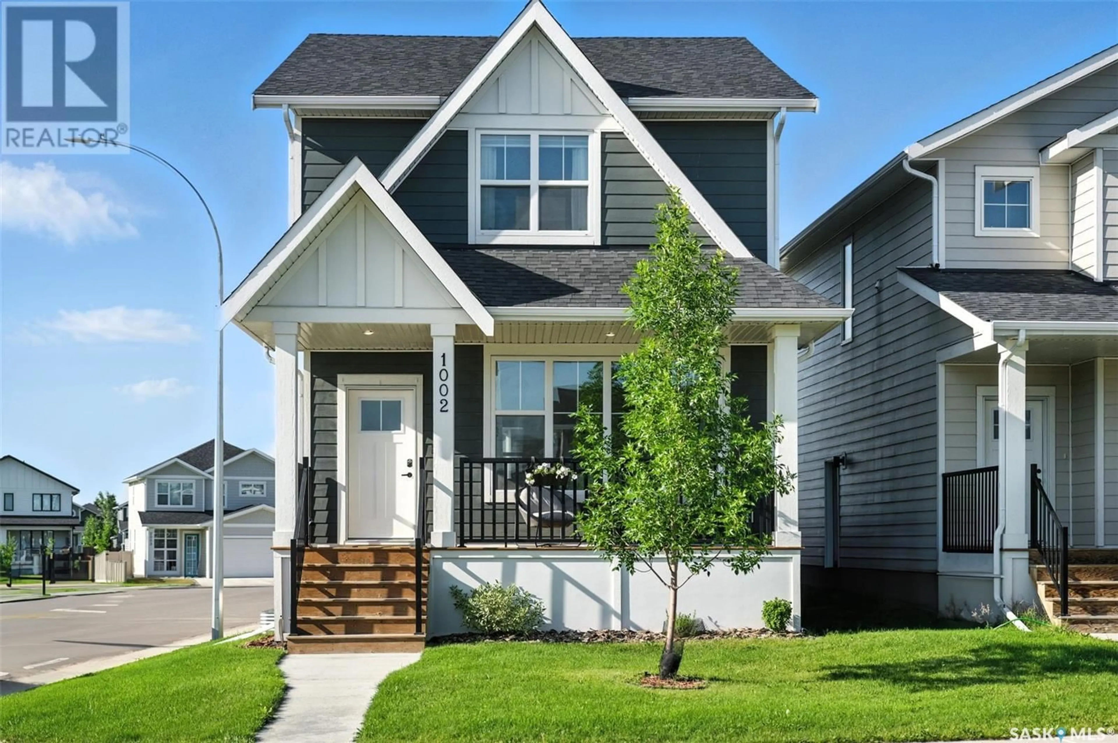 Home with vinyl exterior material, street for 1002 STILLING STREET, Saskatoon Saskatchewan S7V0X2