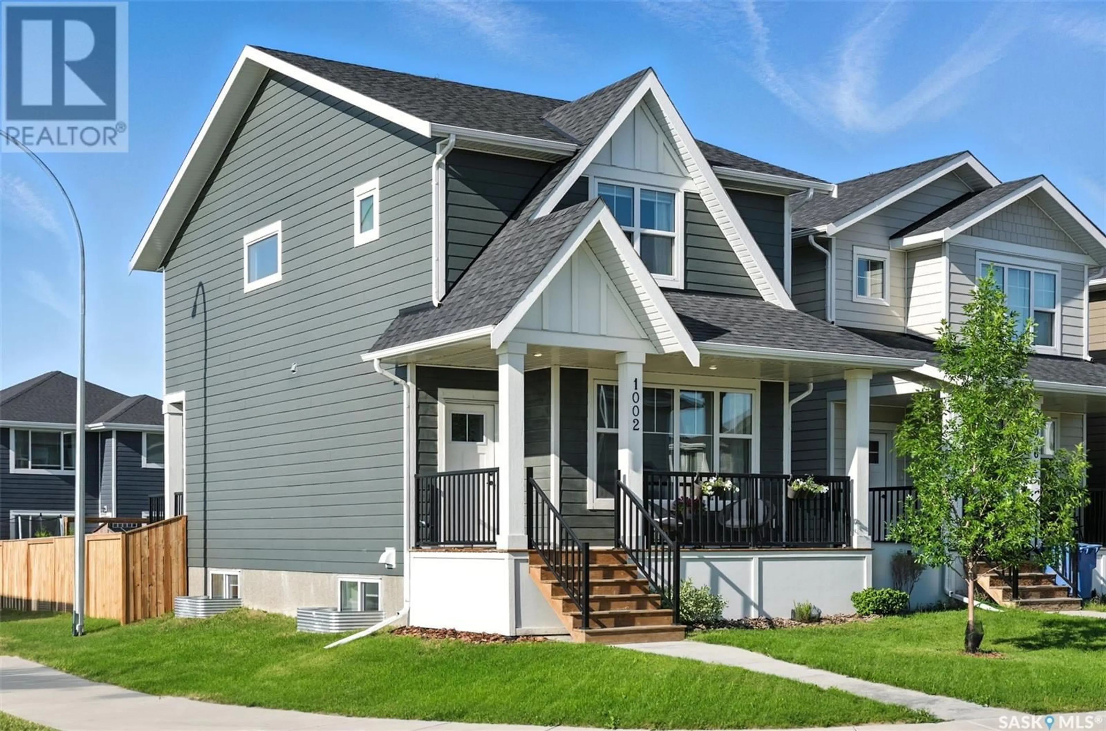 Home with vinyl exterior material, street for 1002 STILLING STREET, Saskatoon Saskatchewan S7V0X2