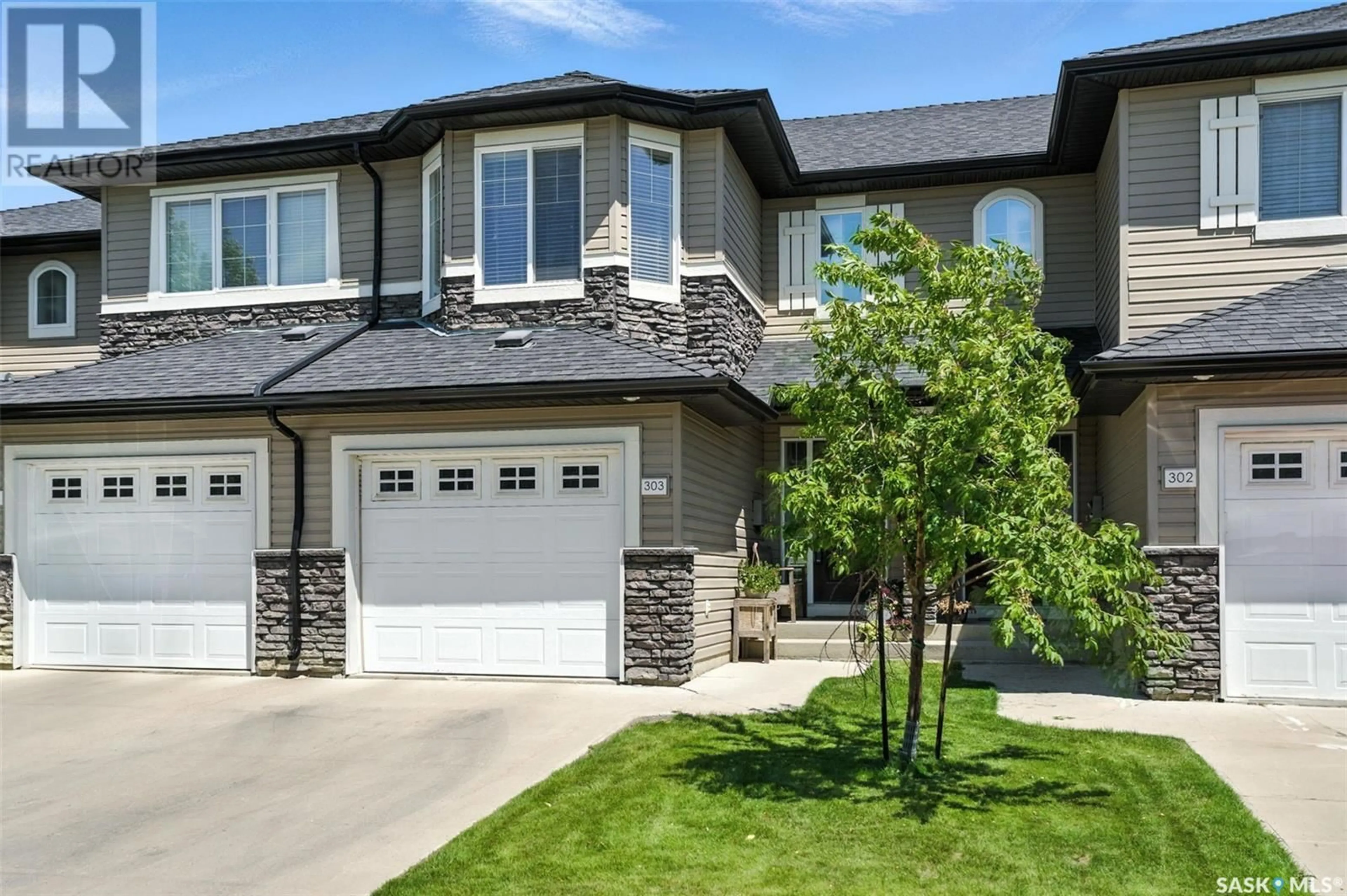 Home with vinyl exterior material, street for 410 - 303 LEDINGHAM WAY, Saskatoon Saskatchewan S7V0C4