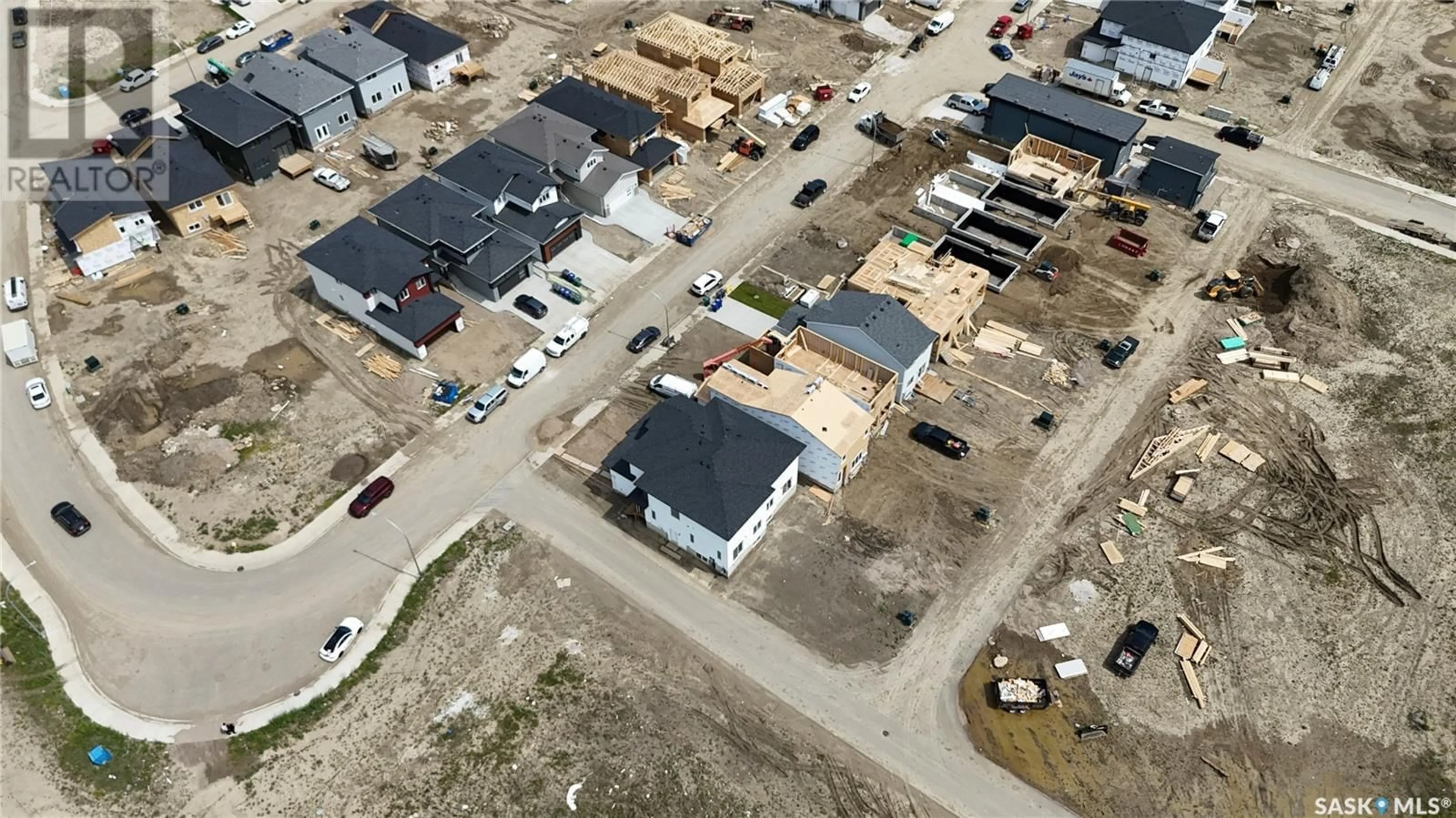 A pic from outside/outdoor area/front of a property/back of a property/a pic from drone, street for 513 SHARMA CRESCENT, Saskatoon Saskatchewan S7W0Y1