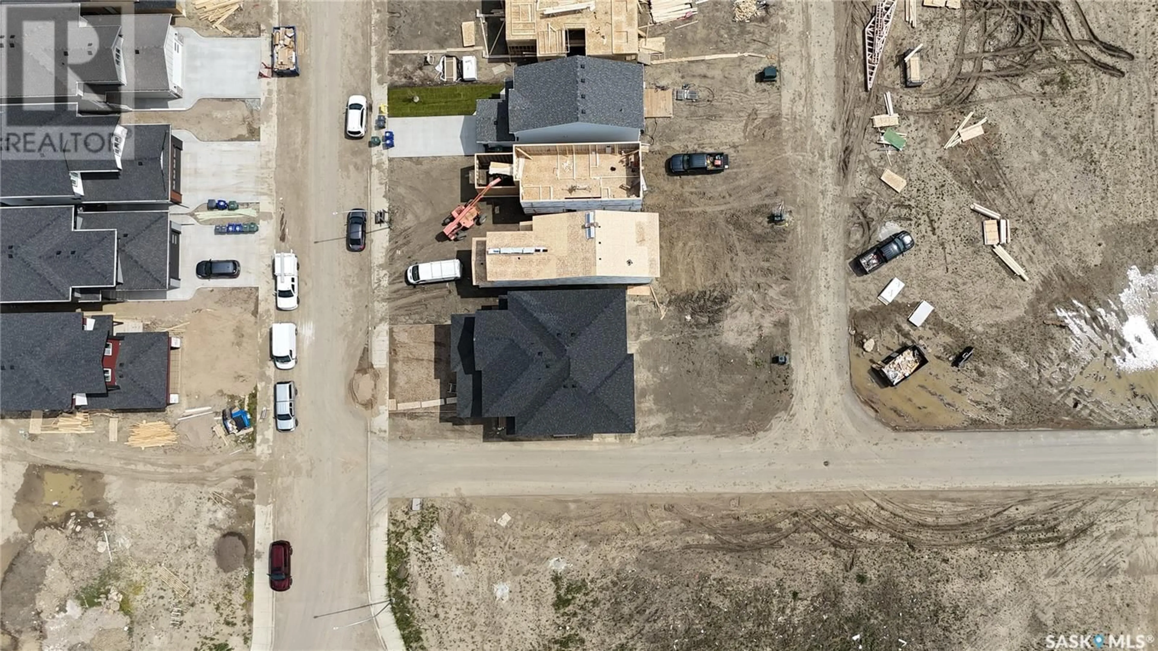 A pic from outside/outdoor area/front of a property/back of a property/a pic from drone, street for 513 SHARMA CRESCENT, Saskatoon Saskatchewan S7W0Y1