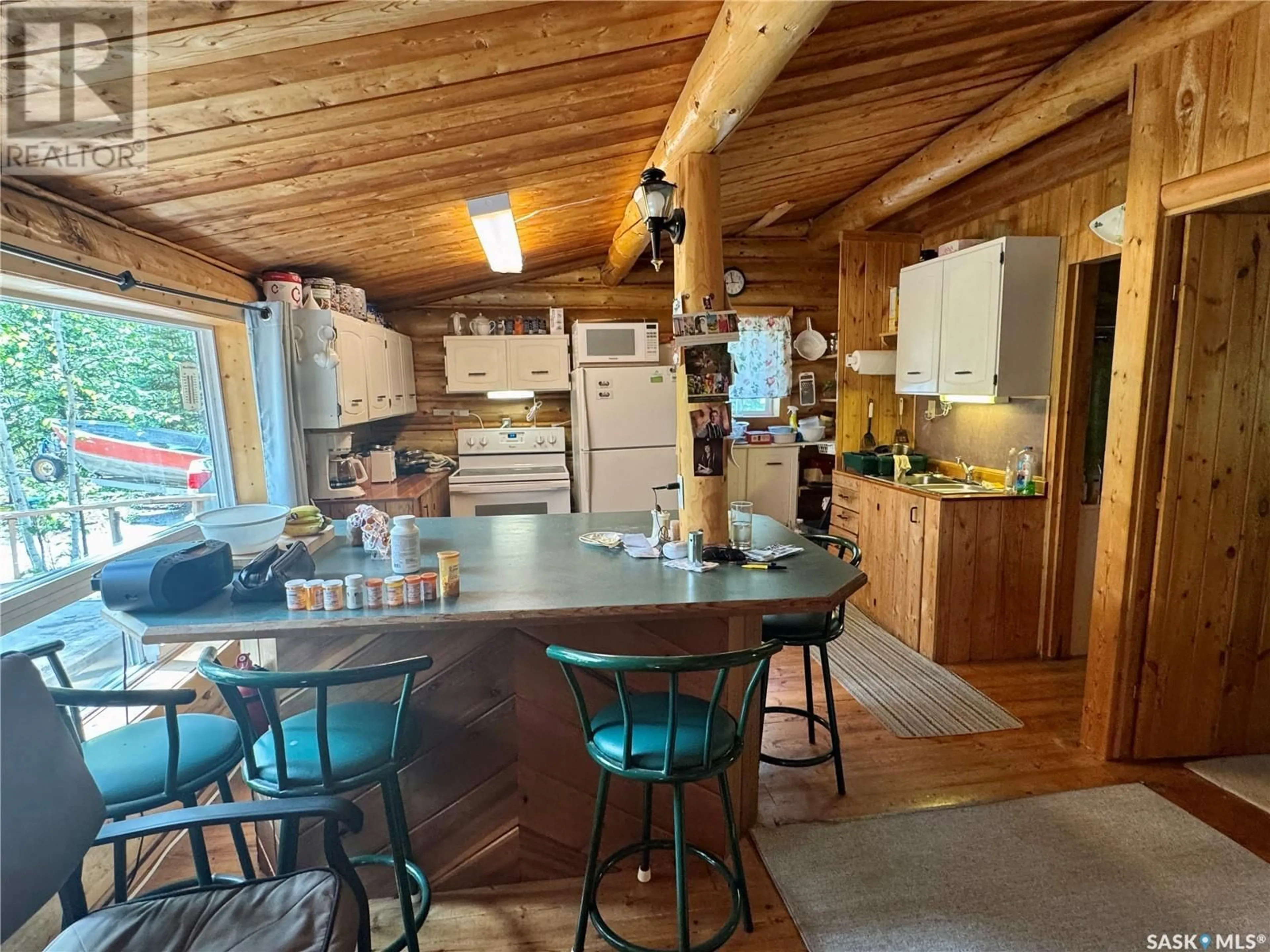 Open concept kitchen, wood/laminate floor for 206 SPRUCE STREET, Northern Admin District Saskatchewan S0J1L0