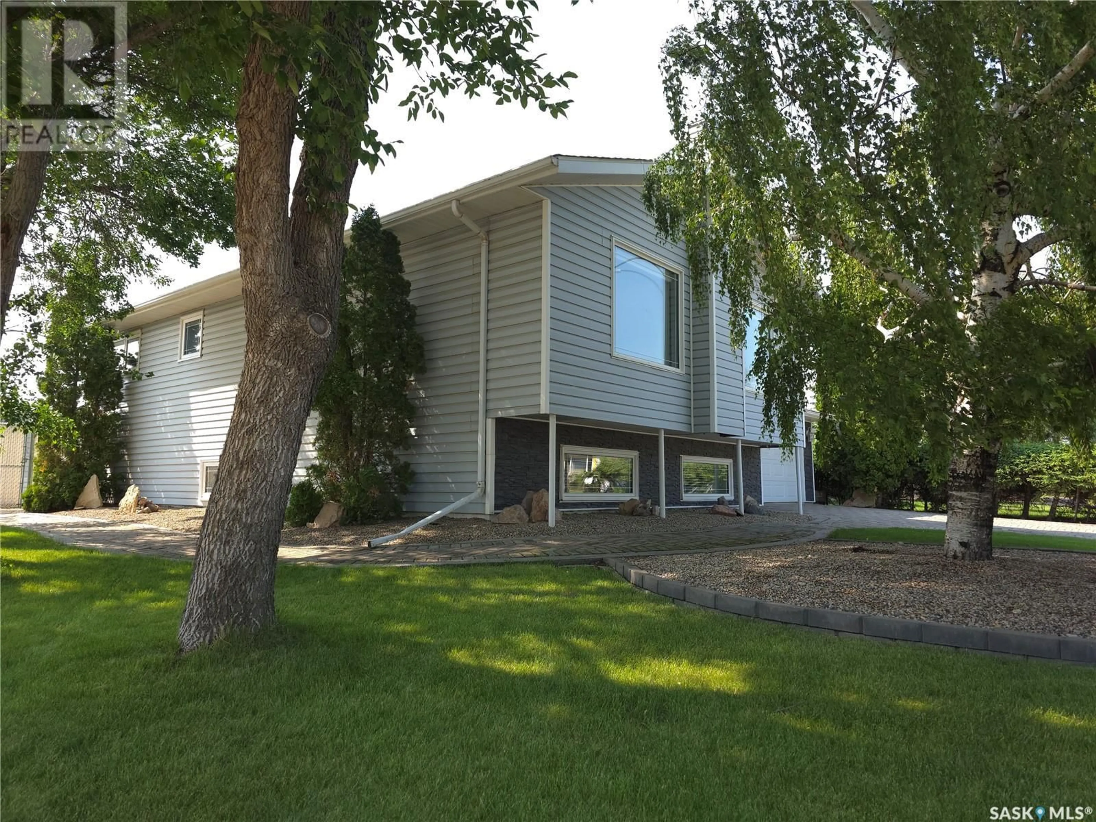 Home with vinyl exterior material, street for 1 VALECREST PLACE, Tisdale Saskatchewan S0E1T0