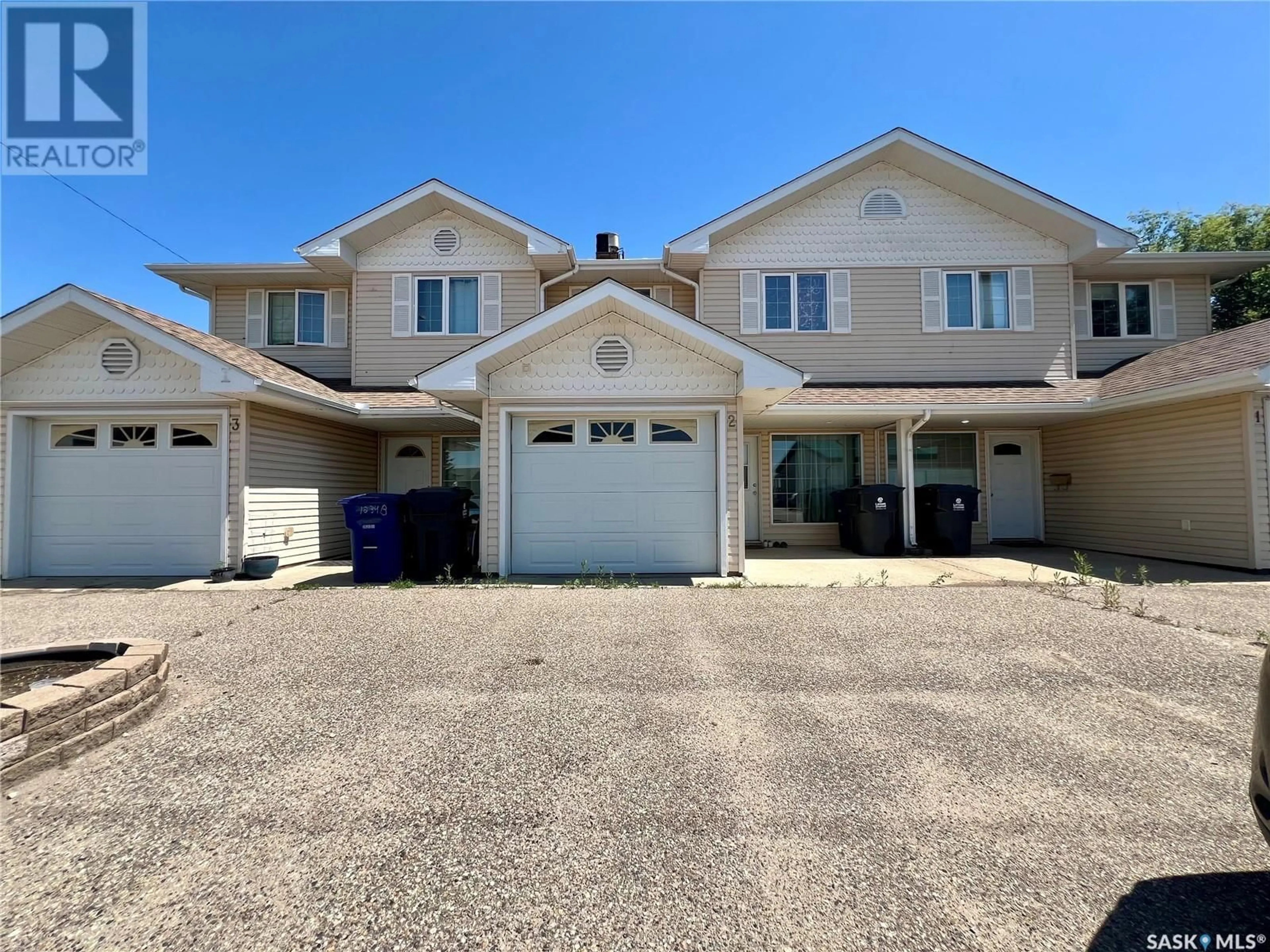 A pic from outside/outdoor area/front of a property/back of a property/a pic from drone, street for 4 - 506 CENTENNIAL BOULEVARD, Warman Saskatchewan S0K4S0