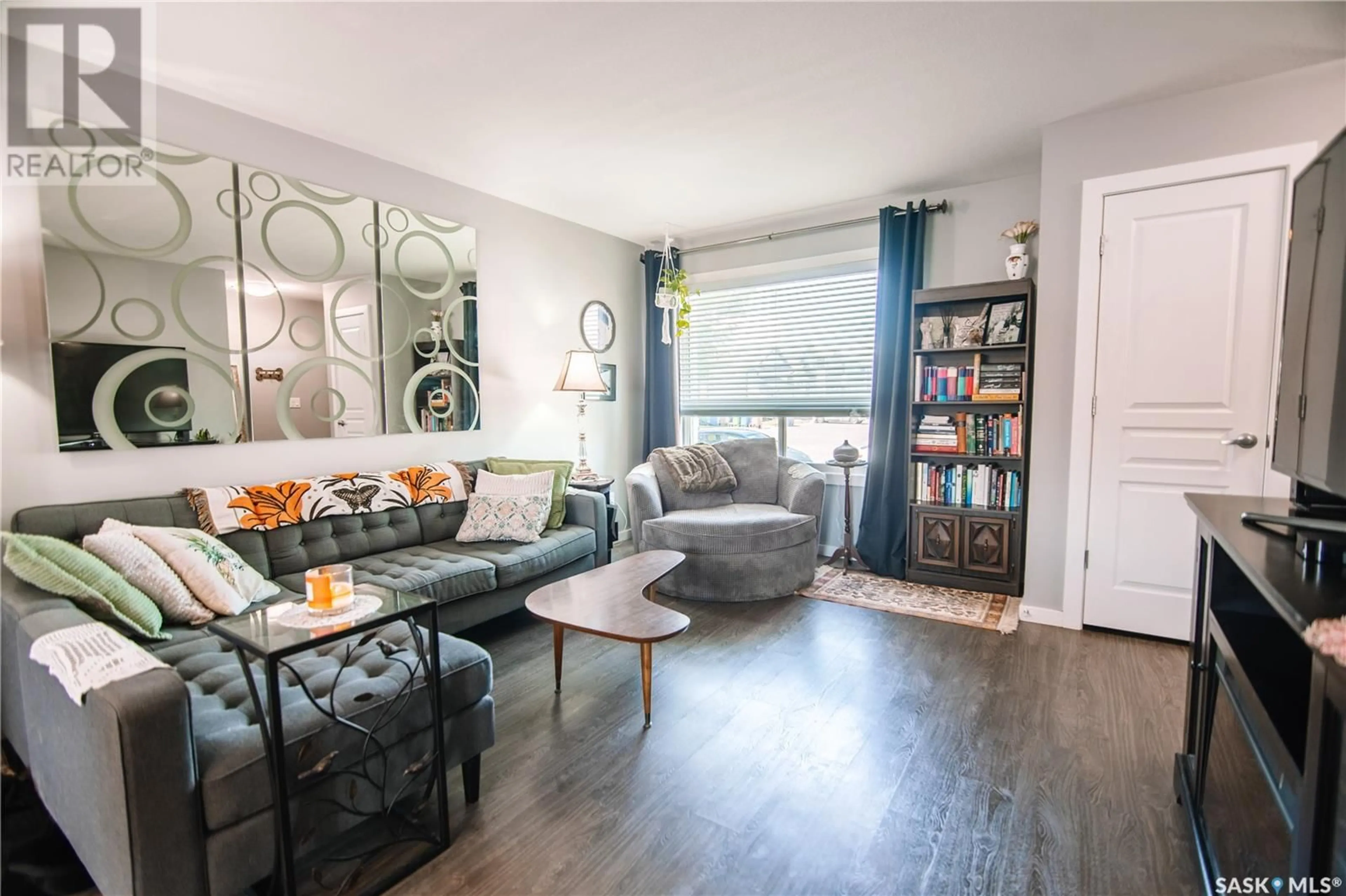 Living room with furniture, wood/laminate floor for 5117 BEACON WAY, Regina Saskatchewan S4W0H8