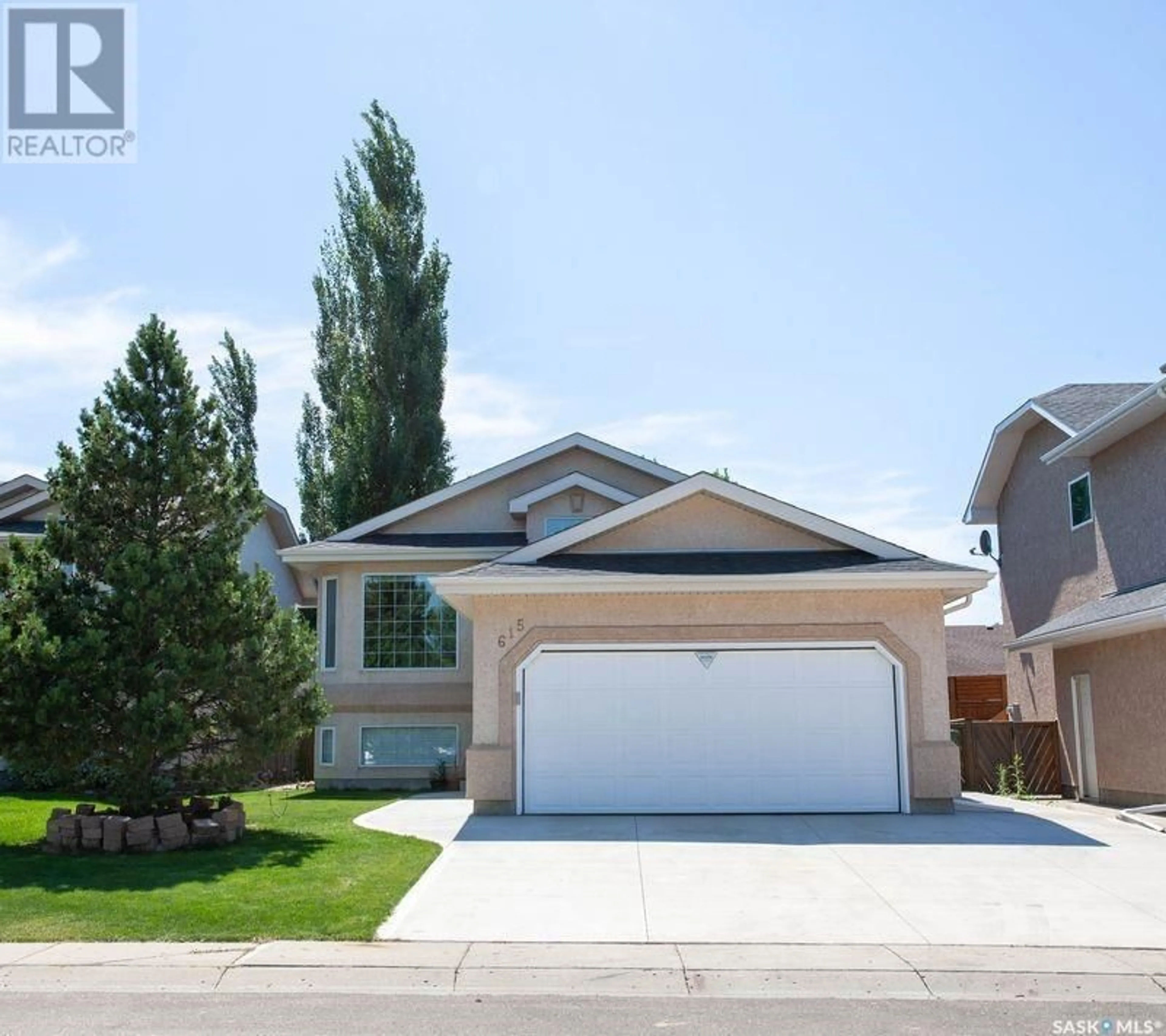 Home with vinyl exterior material, street for 615 GUENTER CRESCENT, Saskatoon Saskatchewan S7N4P8