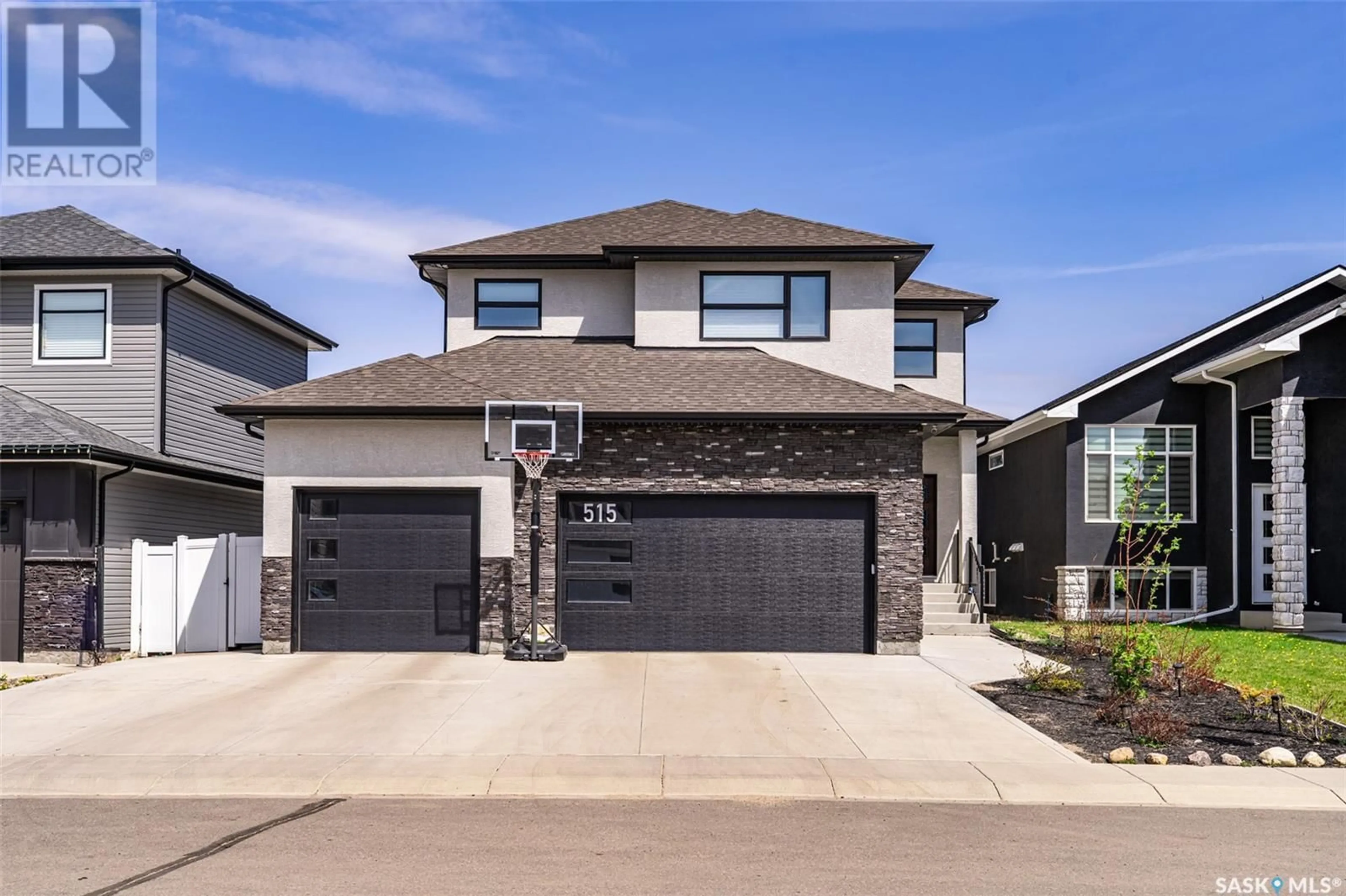 Home with brick exterior material, street for 515 KENASCHUK WAY, Saskatoon Saskatchewan S7W0C2