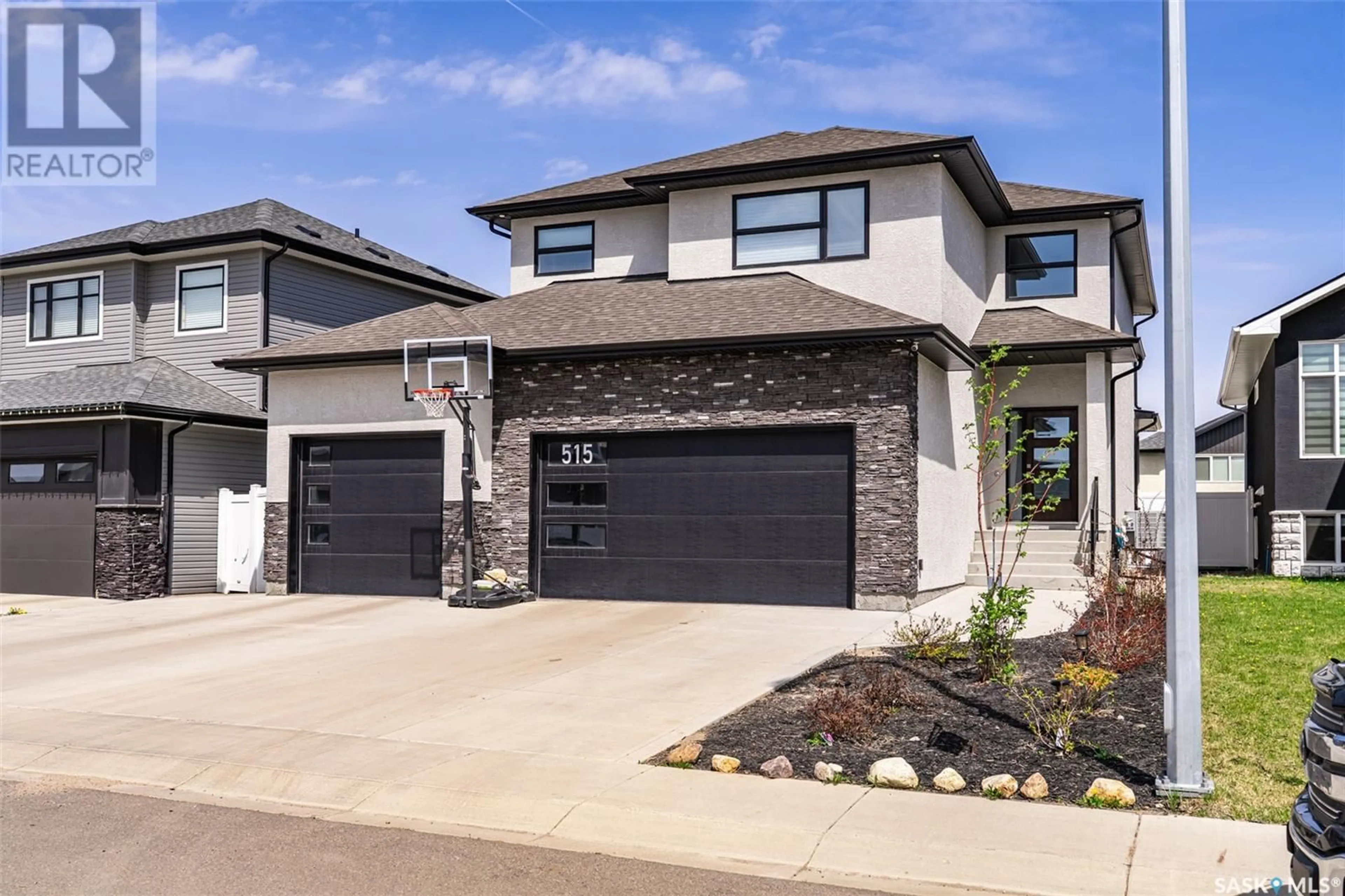 Home with brick exterior material, street for 515 KENASCHUK WAY, Saskatoon Saskatchewan S7W0C2
