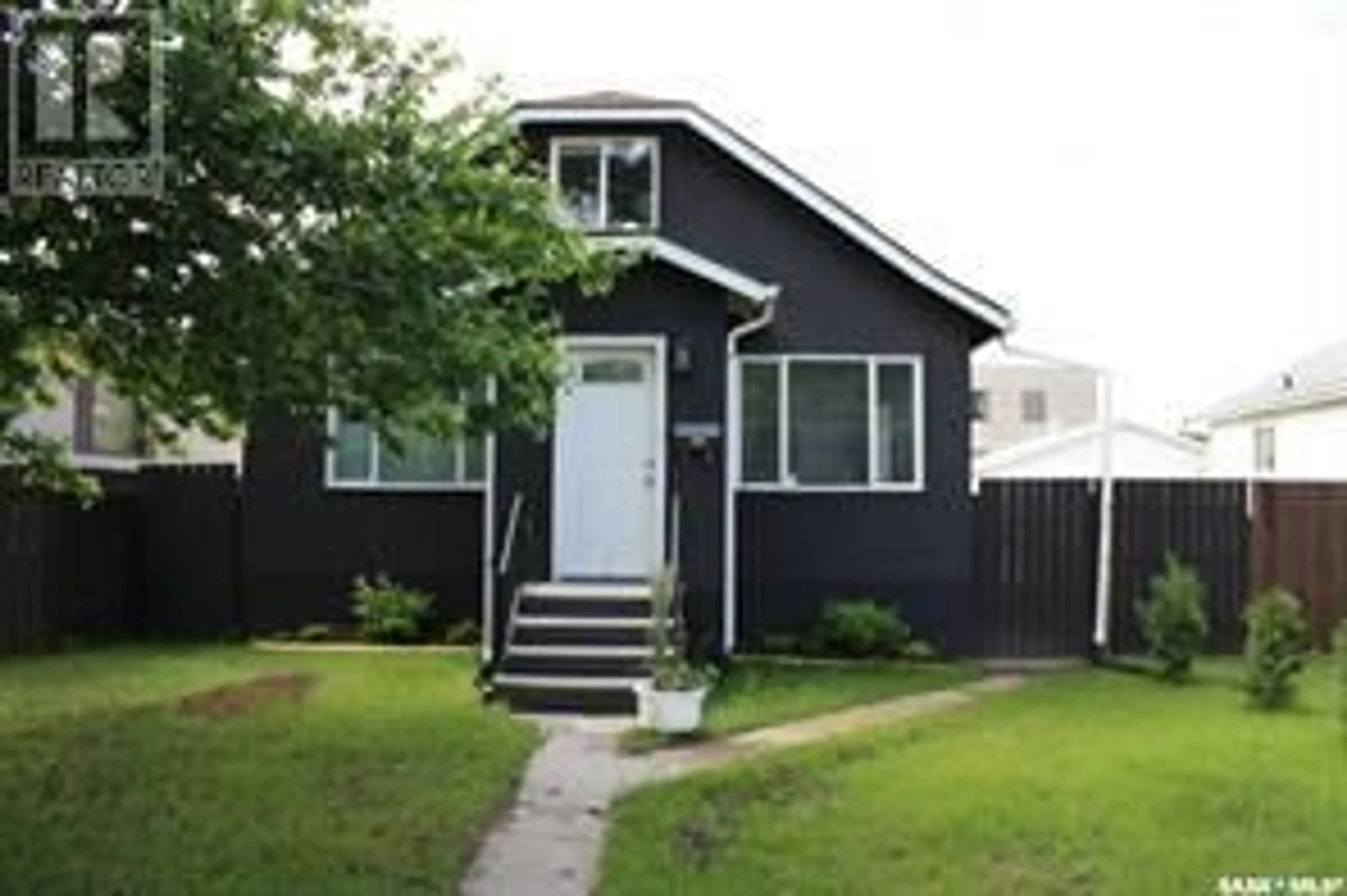 Home with vinyl exterior material, street for 1111 23RD STREET, Saskatoon Saskatchewan S7L0A7