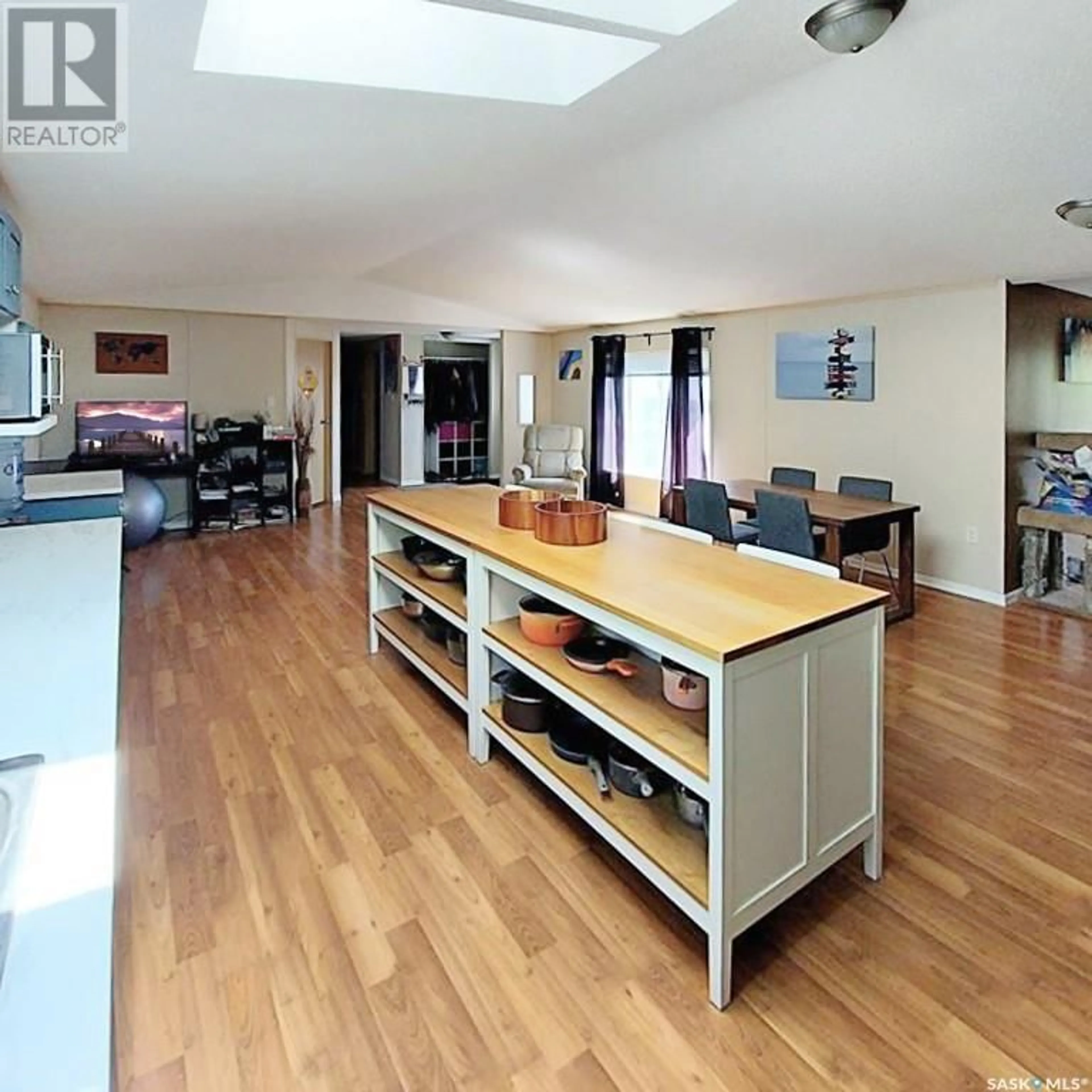 Open concept kitchen, wood/laminate floor for 118 4TH AVENUE, Neilburg Saskatchewan S0M2C0