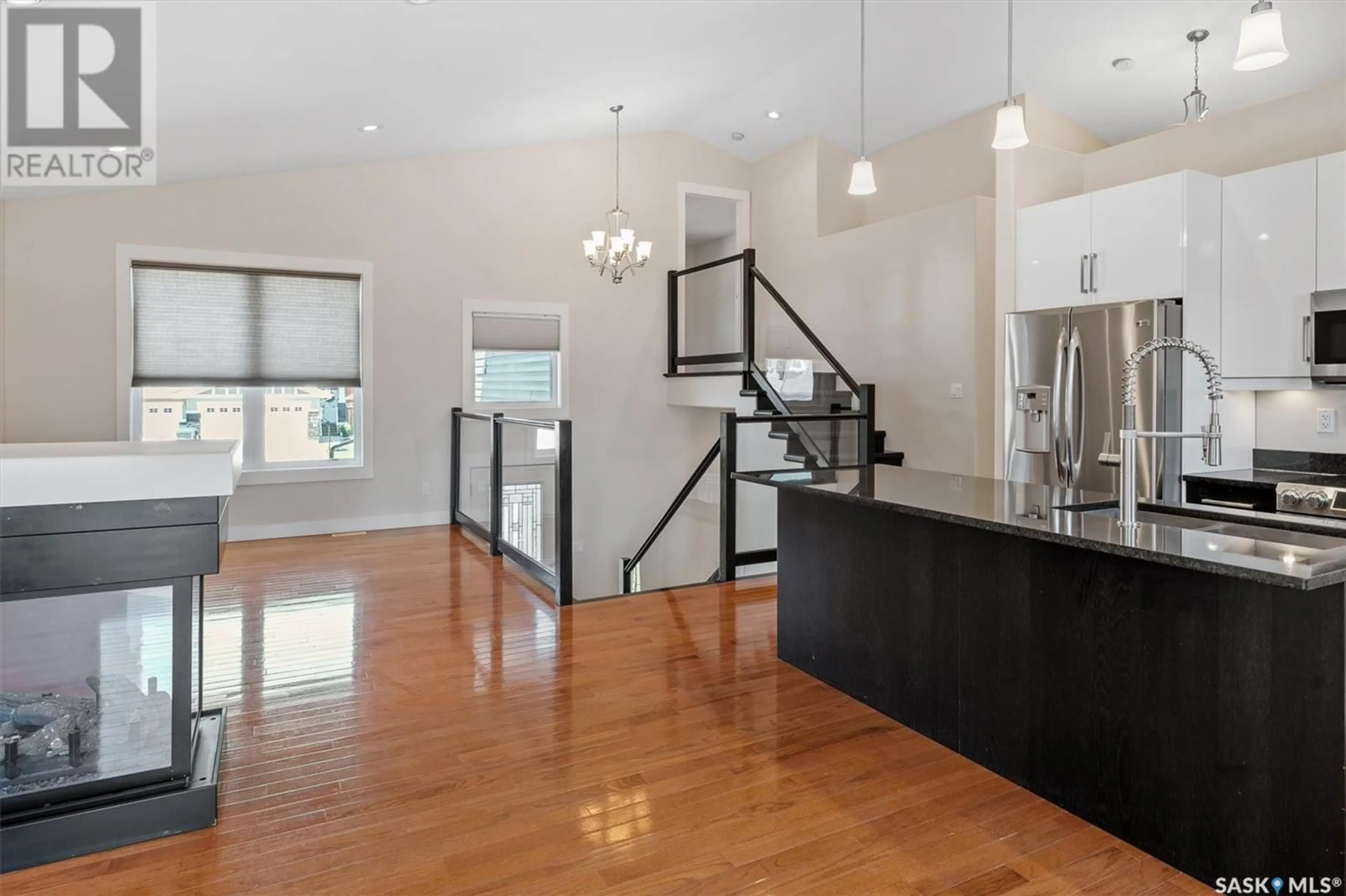 Open concept kitchen, wood/laminate floor for 351 PICHLER CRESCENT, Saskatoon Saskatchewan S7V0G3