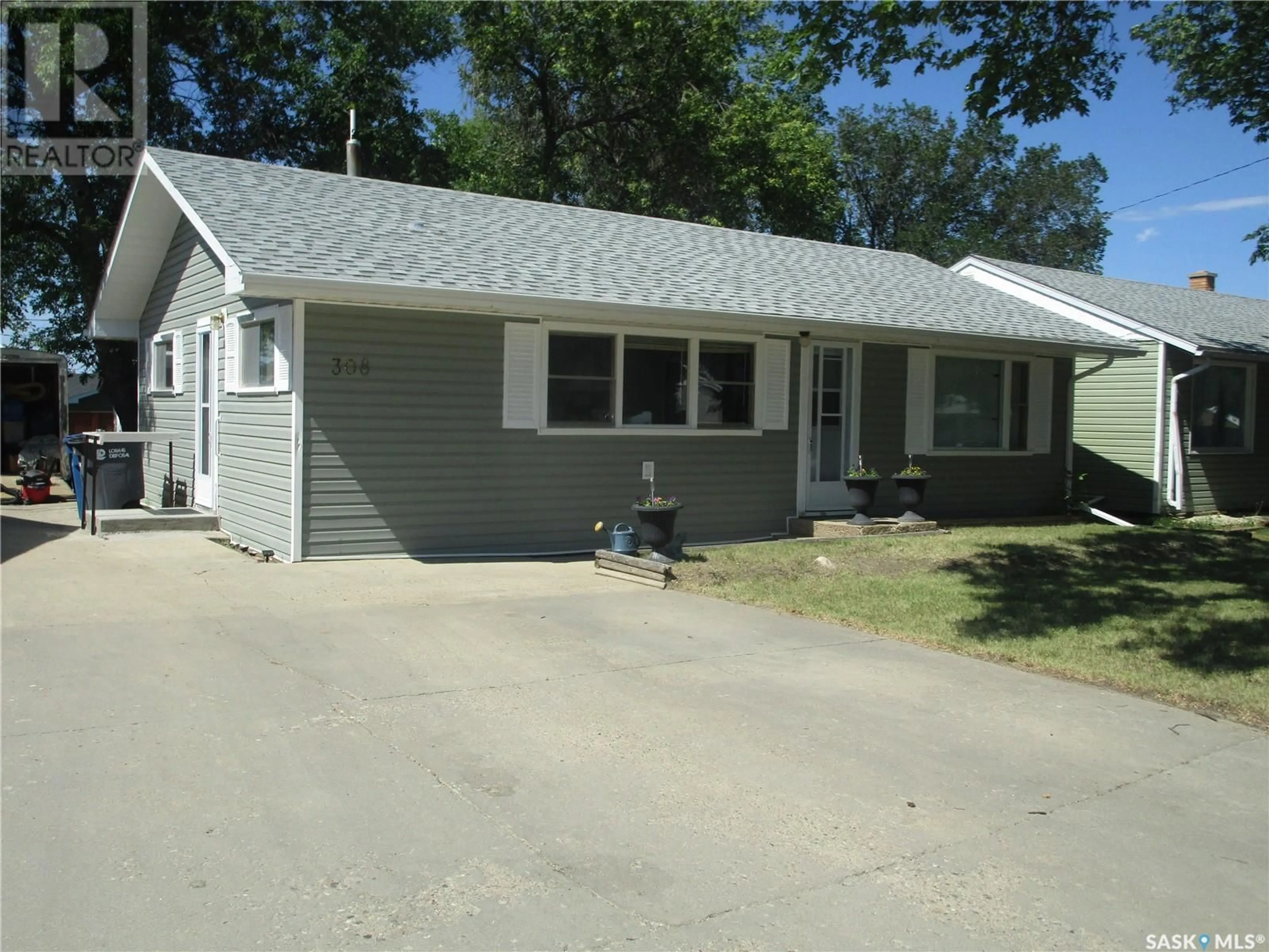 Home with vinyl exterior material, street for 308 DOMINION ROAD, Assiniboia Saskatchewan S0H0B0