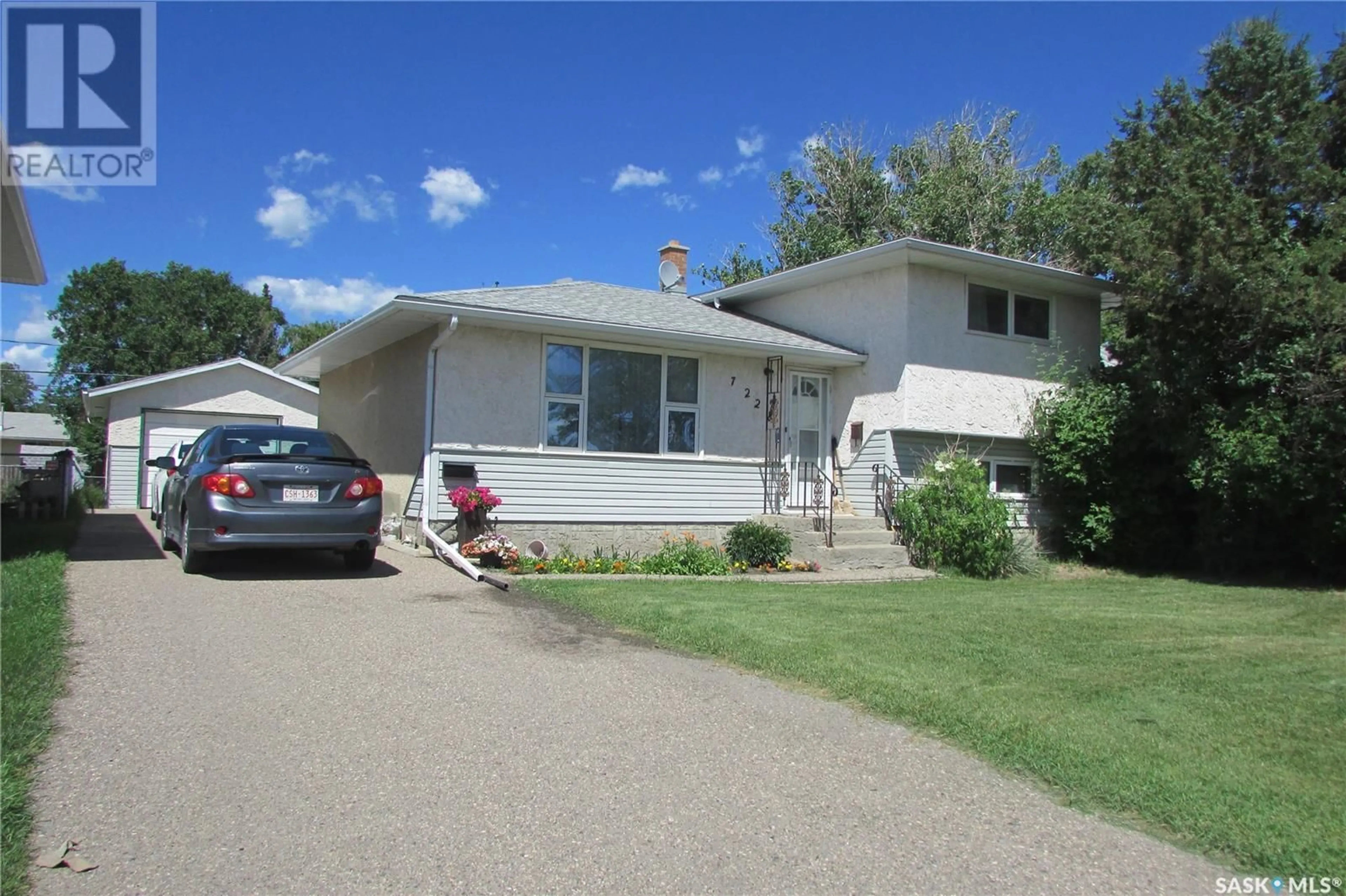 Home with vinyl exterior material, street for 7228 DEWDNEY AVENUE, Regina Saskatchewan S4T1E6