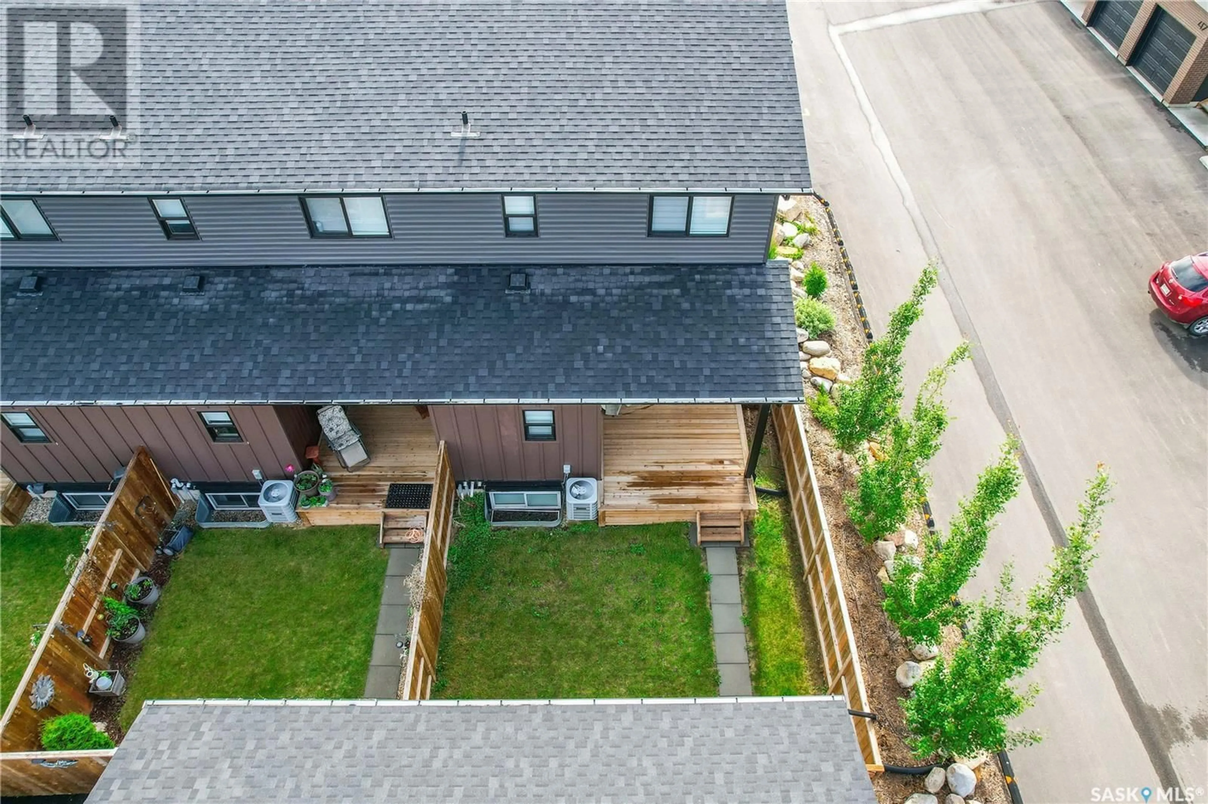 A pic from outside/outdoor area/front of a property/back of a property/a pic from drone, street for 20 619 EVERGREEN BOULEVARD, Saskatoon Saskatchewan S7W0Y7
