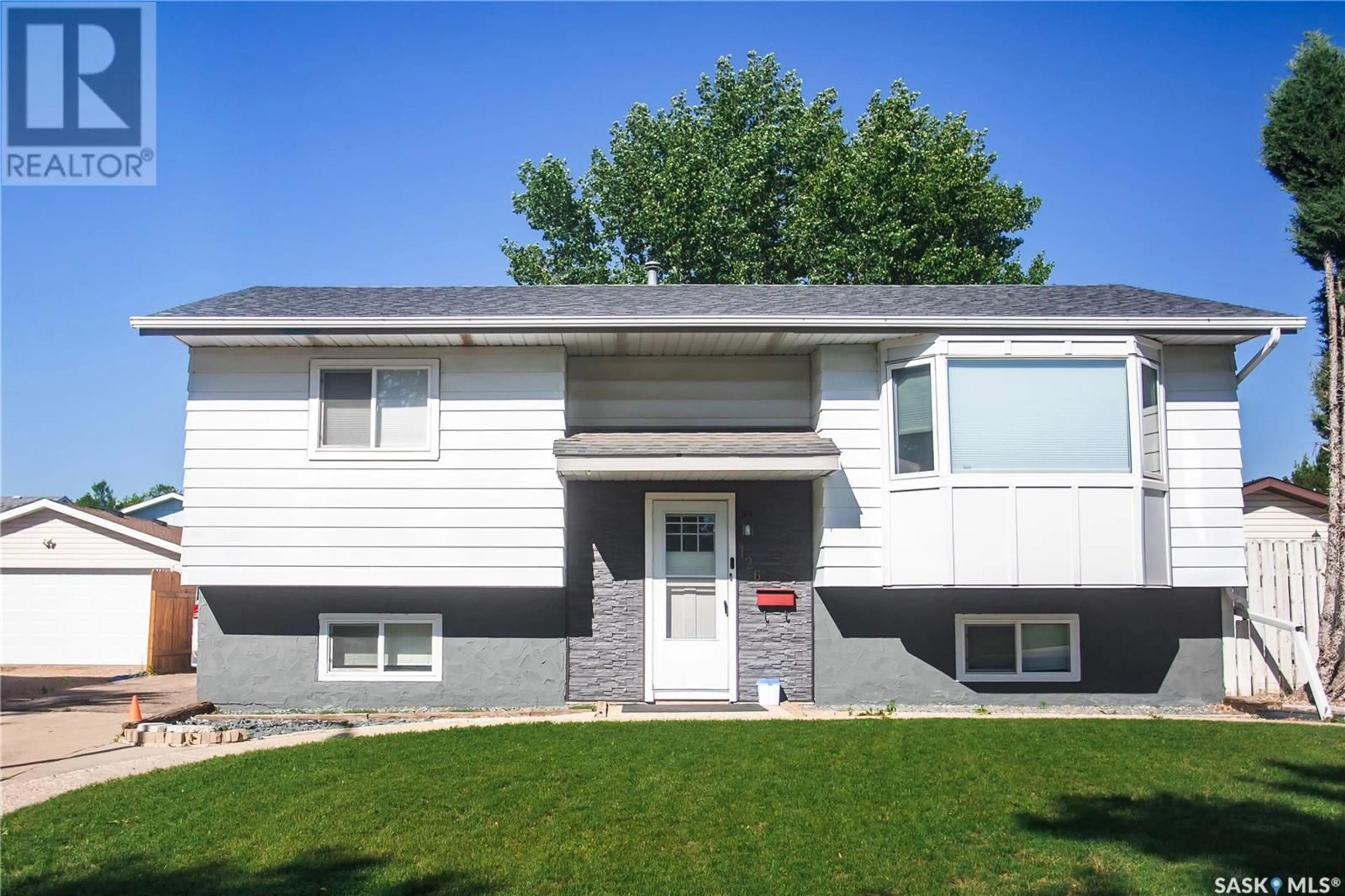 Home with vinyl exterior material, street for 126 COOPER CRESCENT, Saskatoon Saskatchewan S7M4L3