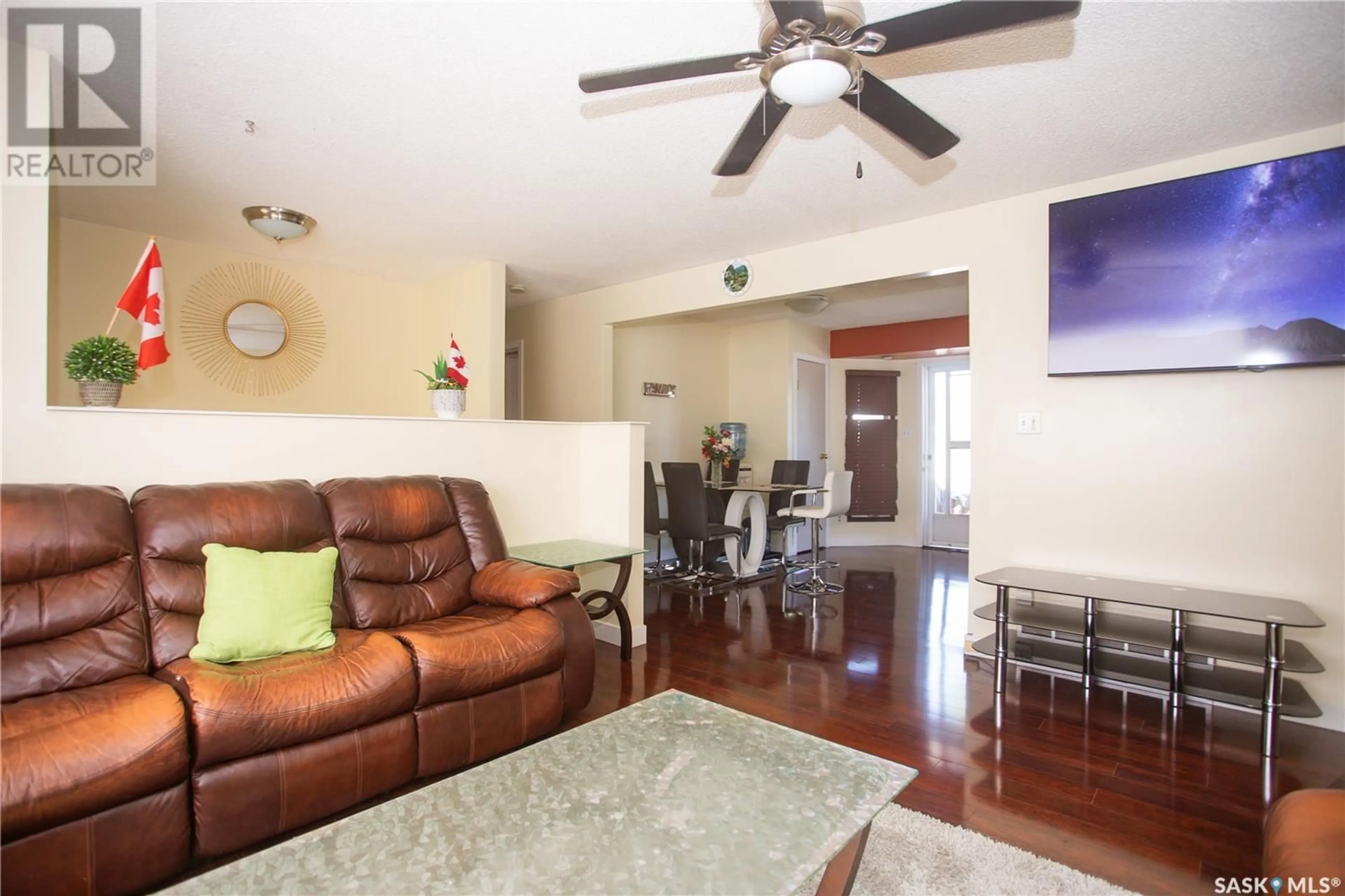 Living room with furniture, wood/laminate floor for 126 COOPER CRESCENT, Saskatoon Saskatchewan S7M4L3