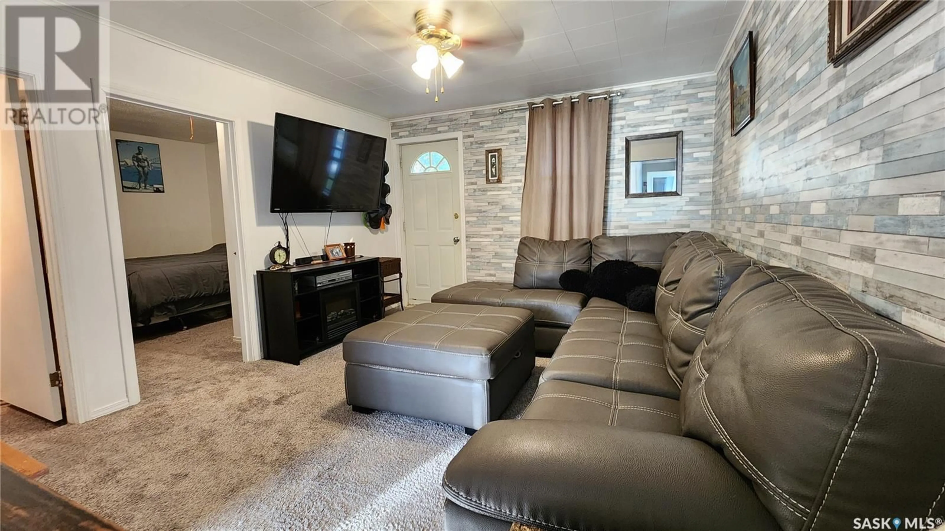 Living room with furniture, unknown for 921 109TH STREET, North Battleford Saskatchewan S9A2E1