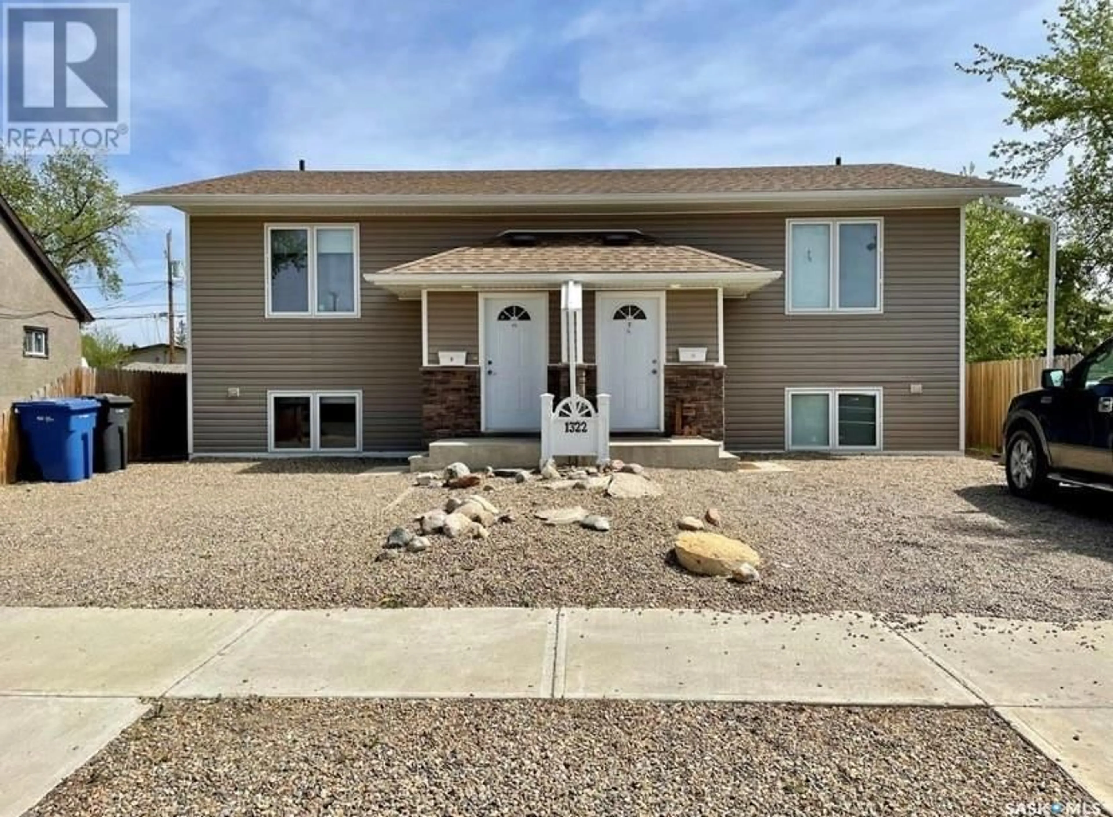 Home with vinyl exterior material, street for B - 1322 107TH STREET, North Battleford Saskatchewan S9A1Z7
