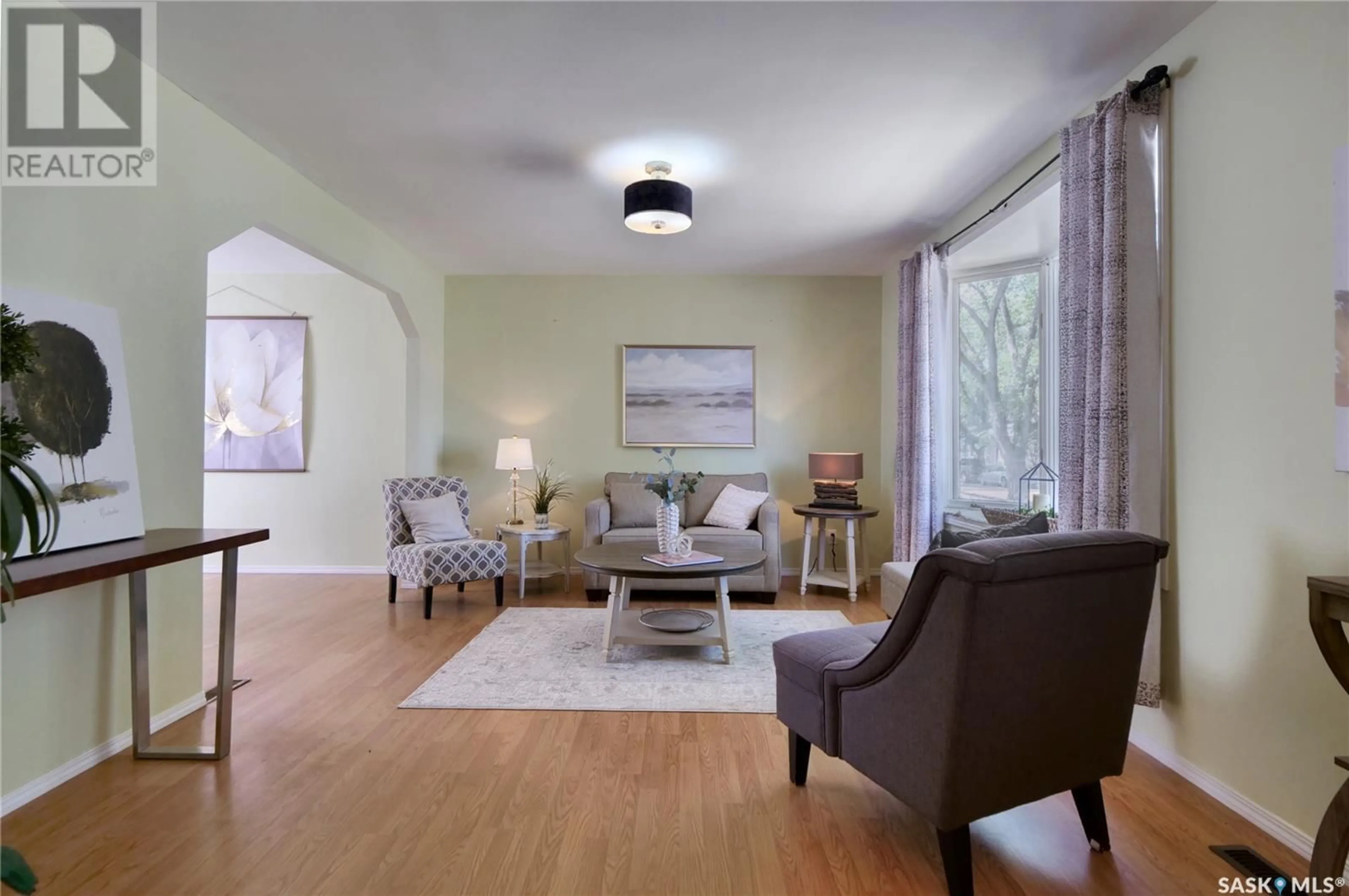 Living room with furniture, wood/laminate floor for 1085 6TH AVENUE, Moose Jaw Saskatchewan S6H4A5