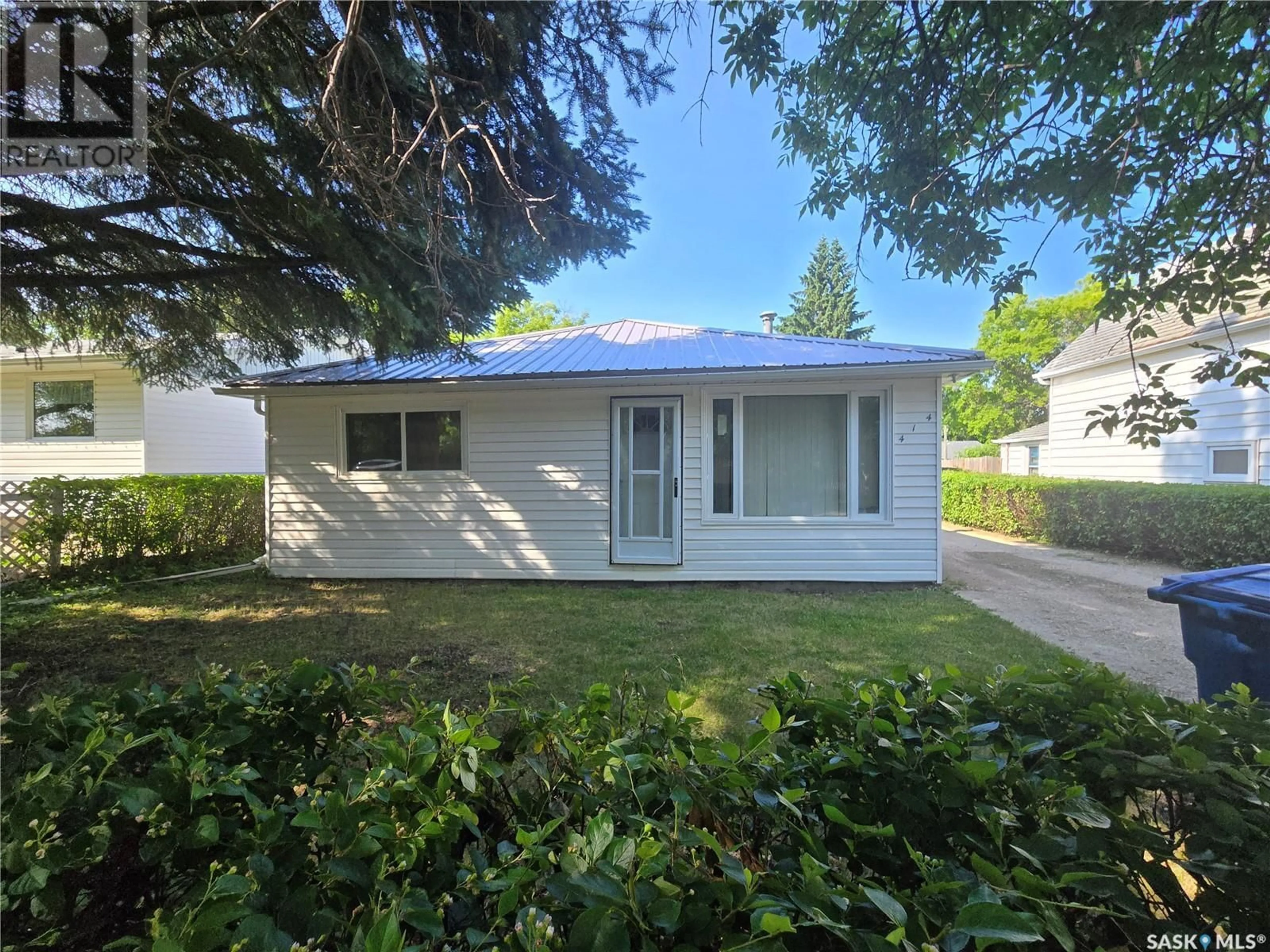 Home with vinyl exterior material, street for 414 2ND STREET, Kipling Saskatchewan S0G2S0