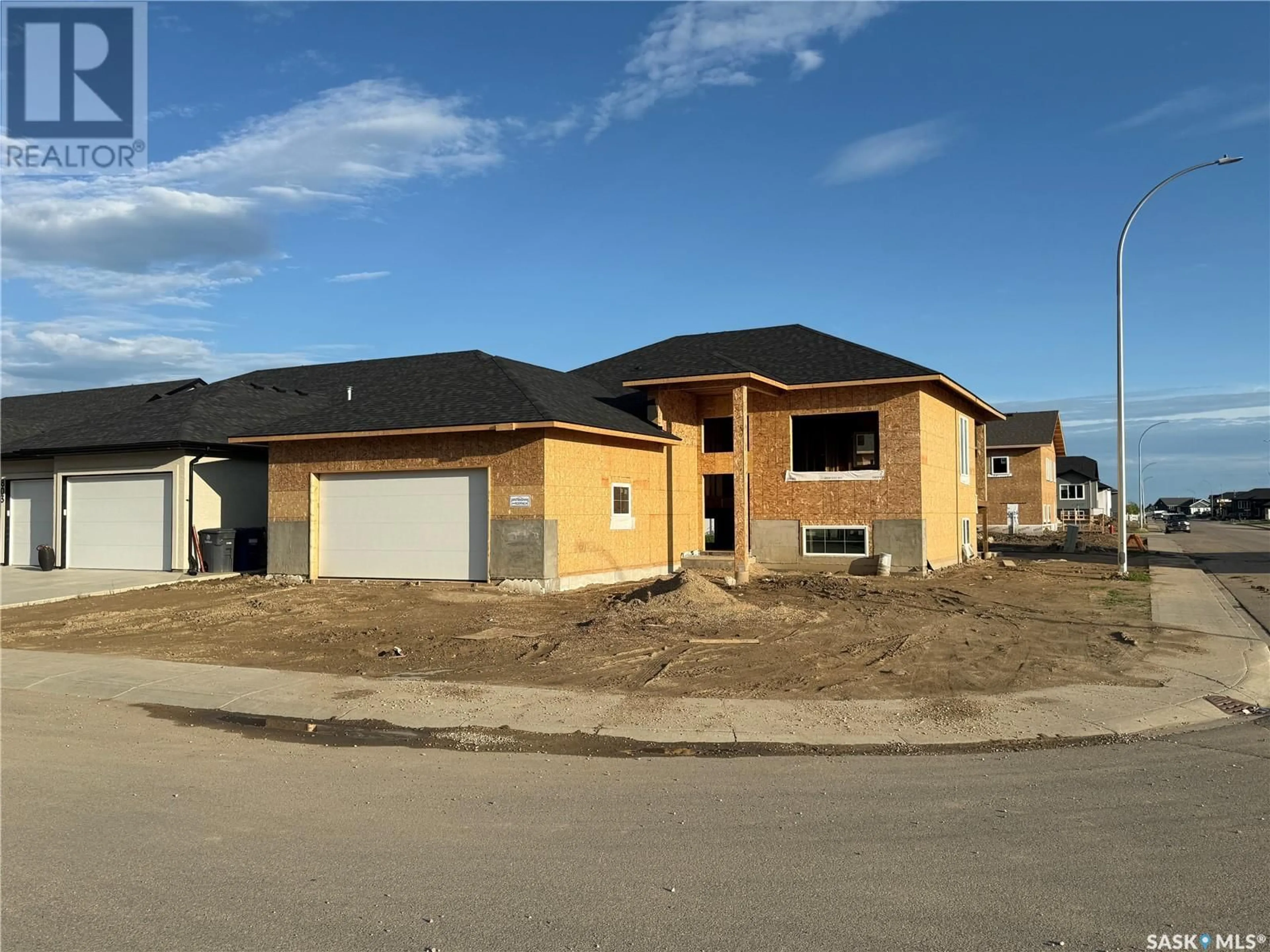 Home with brick exterior material, street for 801 WEIR CRESCENT, Warman Saskatchewan S0K4S4