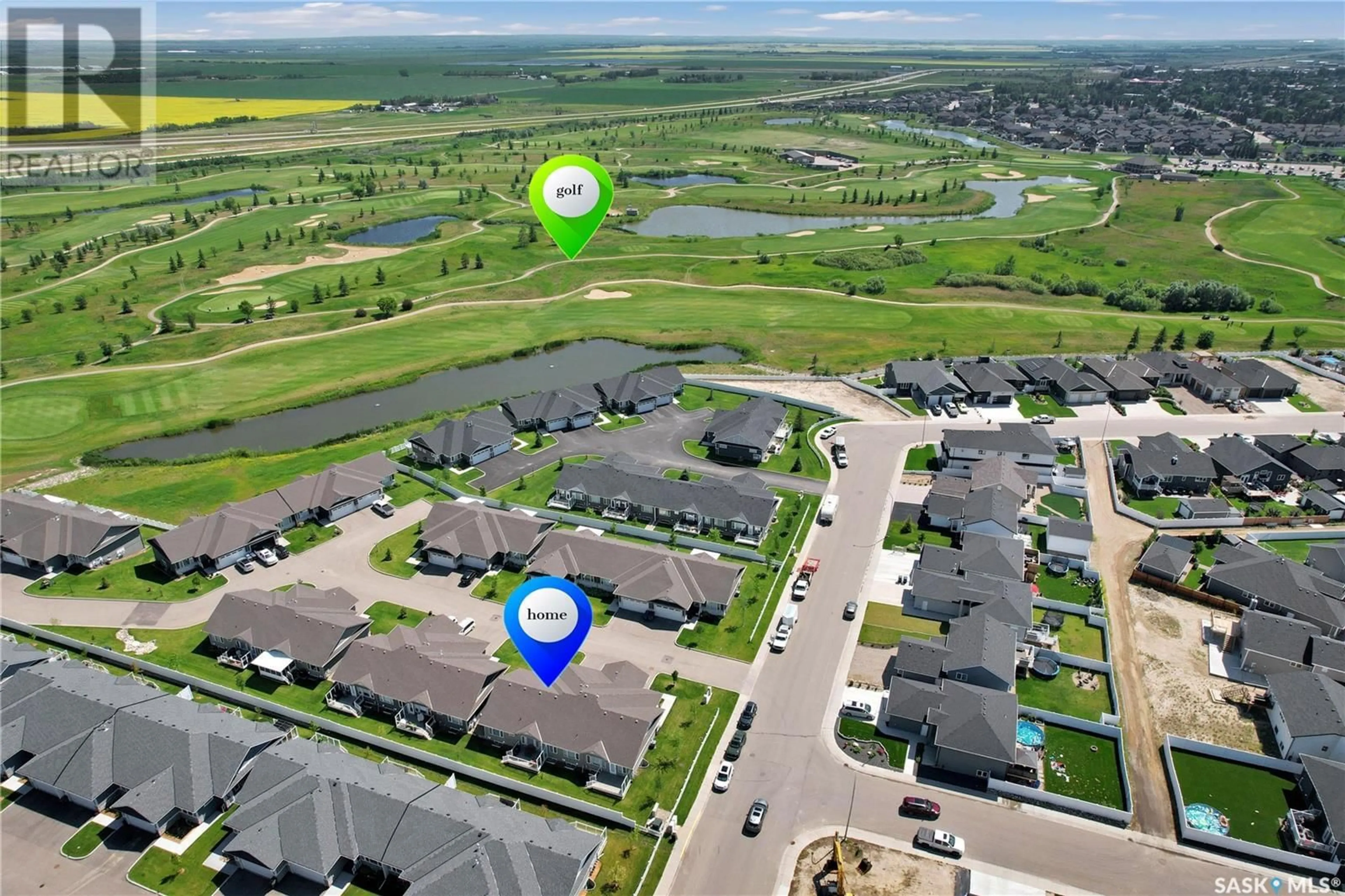 A pic from outside/outdoor area/front of a property/back of a property/a pic from drone, water/lake/river/ocean view for 17 435 PALMER CRESCENT, Warman Saskatchewan S0K4S1