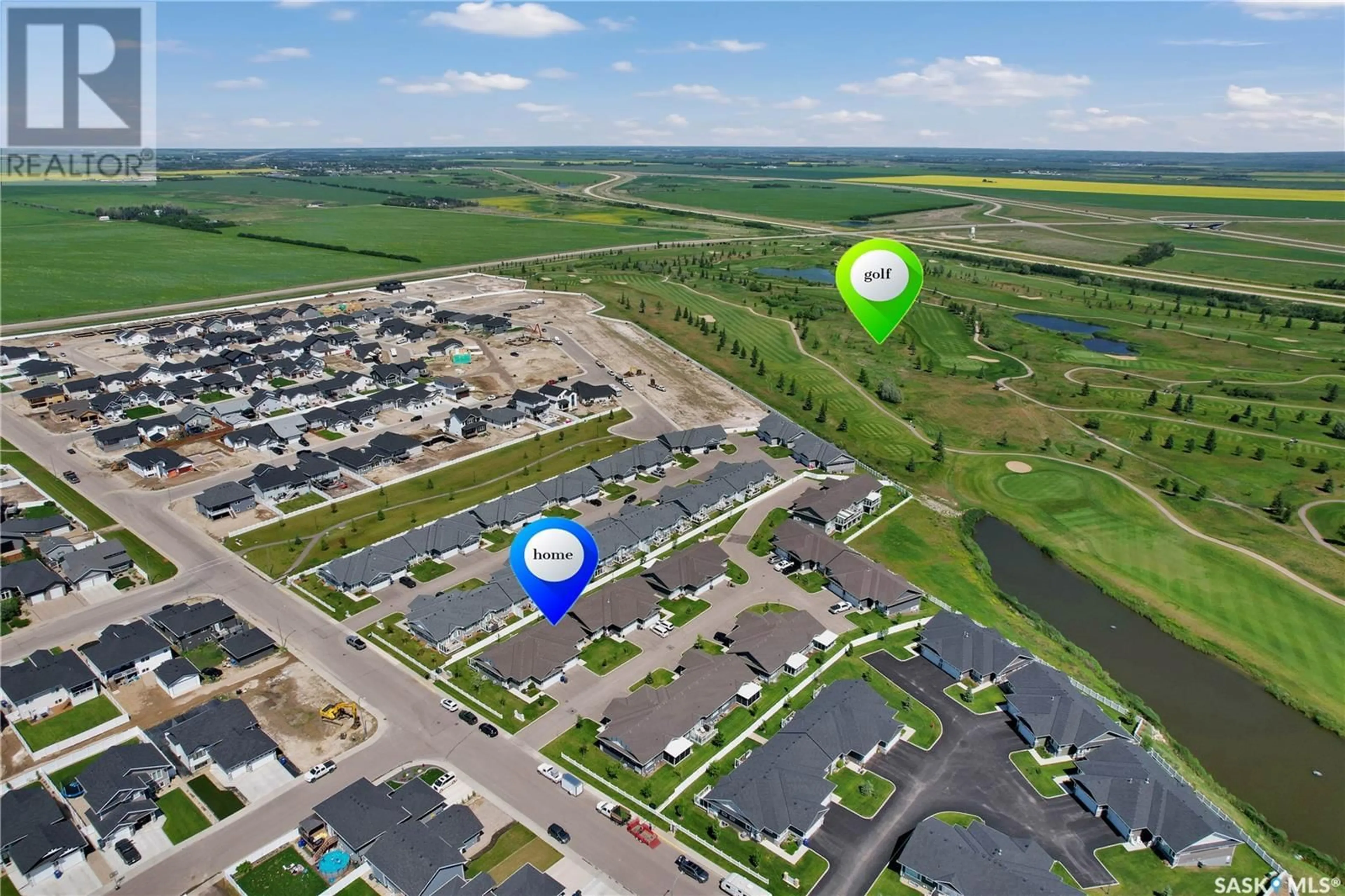 A pic from outside/outdoor area/front of a property/back of a property/a pic from drone, water/lake/river/ocean view for 17 435 PALMER CRESCENT, Warman Saskatchewan S0K4S1
