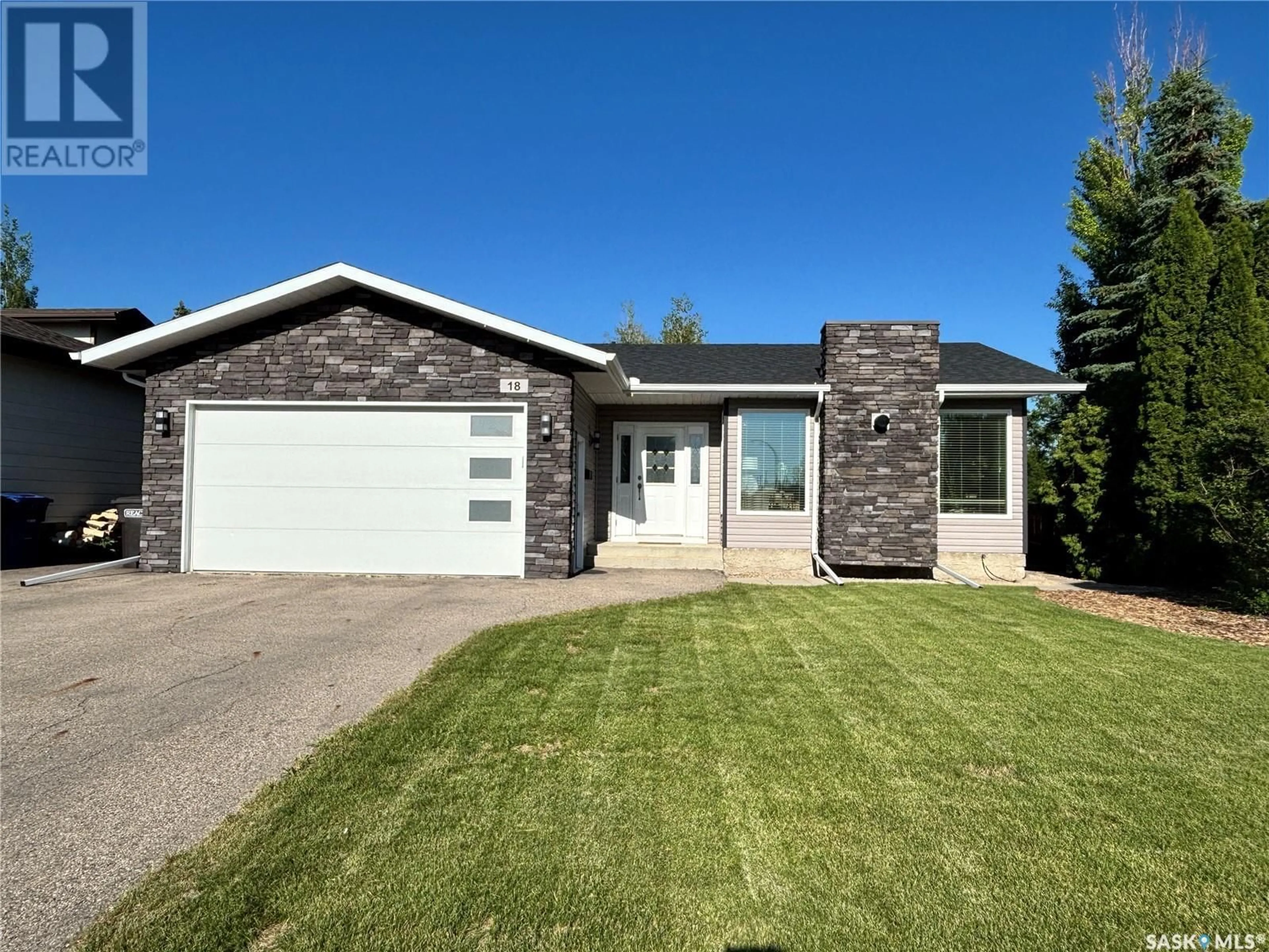 Home with vinyl exterior material, street for 18 DUST CRESCENT, Humboldt Saskatchewan S0K2A0