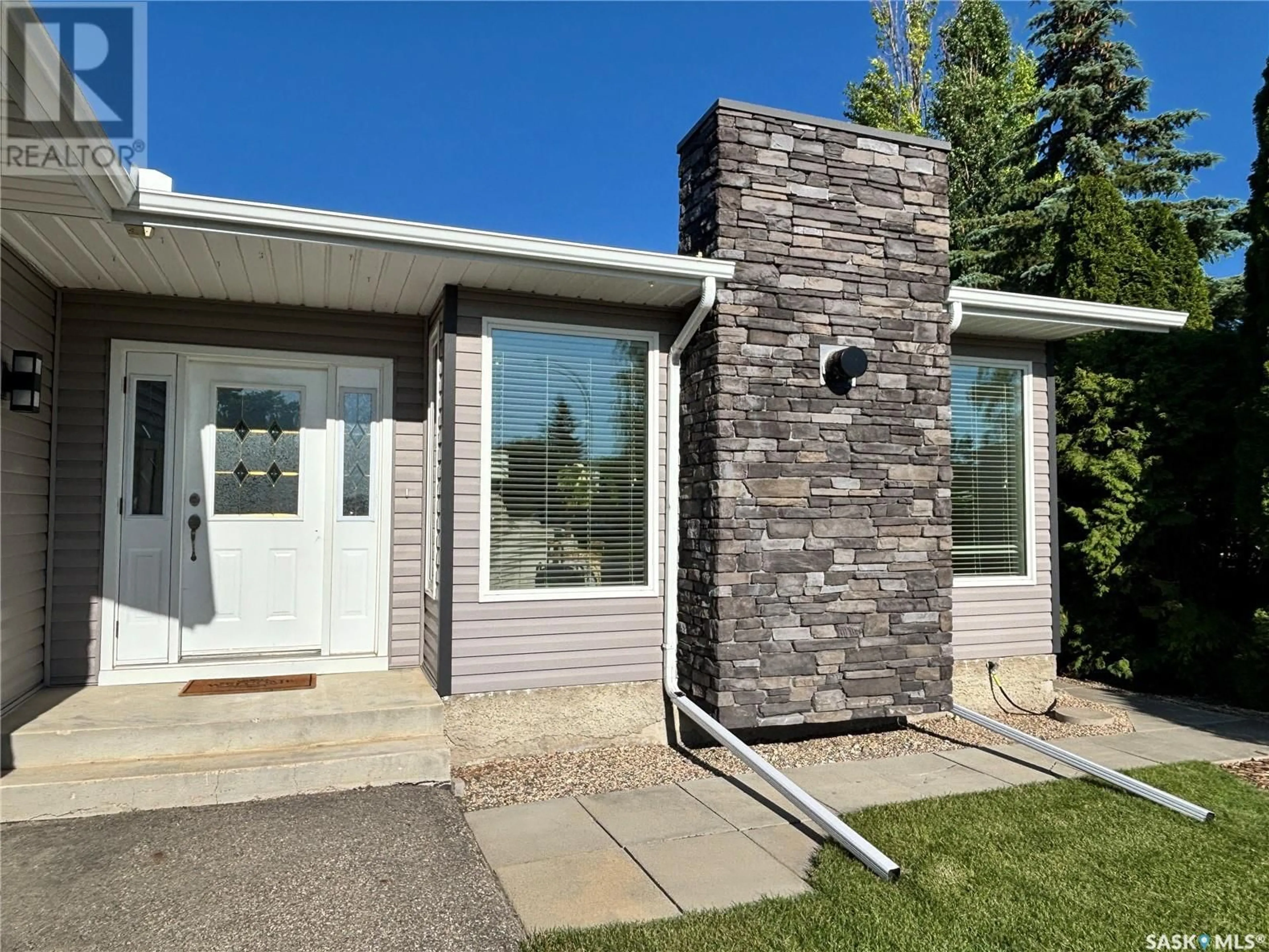 Home with vinyl exterior material, street for 18 DUST CRESCENT, Humboldt Saskatchewan S0K2A0
