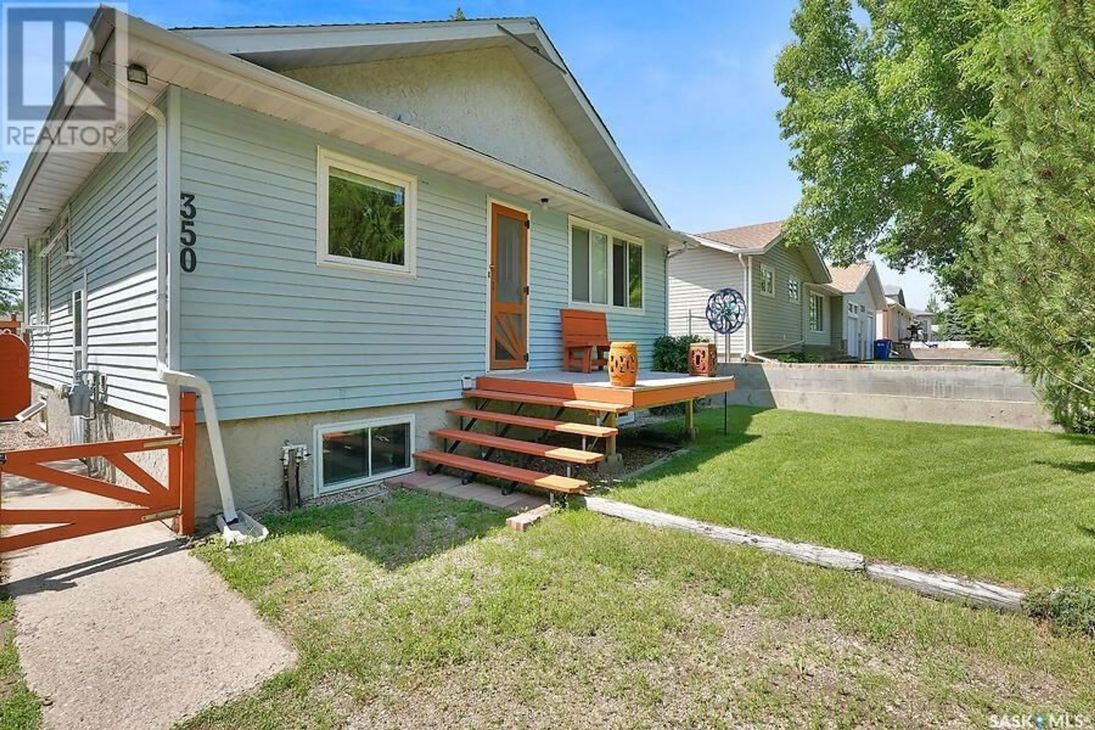 Home with vinyl exterior material, street for 350 3RD STREET, Pilot Butte Saskatchewan S0G3Z0
