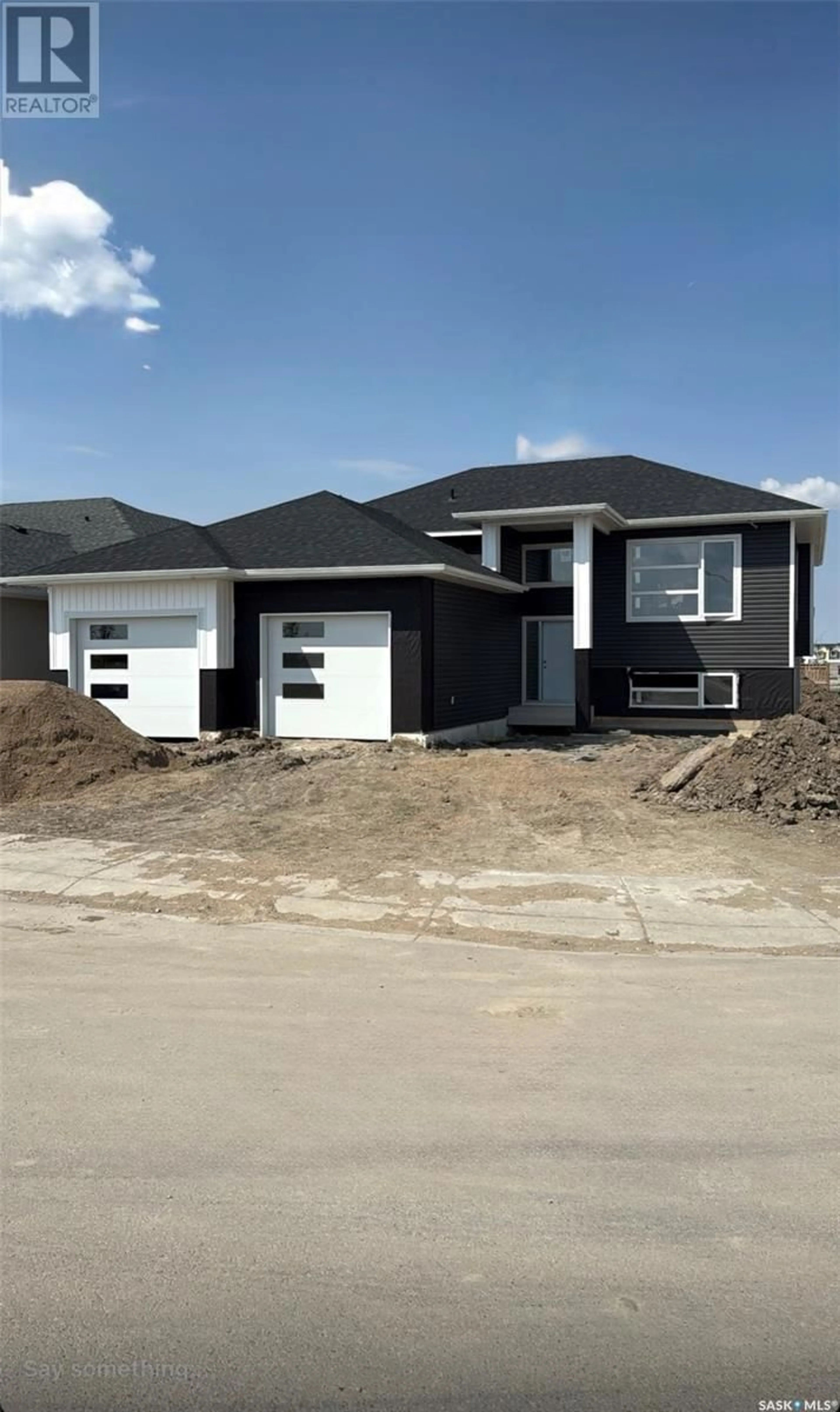 Home with vinyl exterior material, street for 824 BALLESTEROS CRESCENT, Warman Saskatchewan S0K4S4