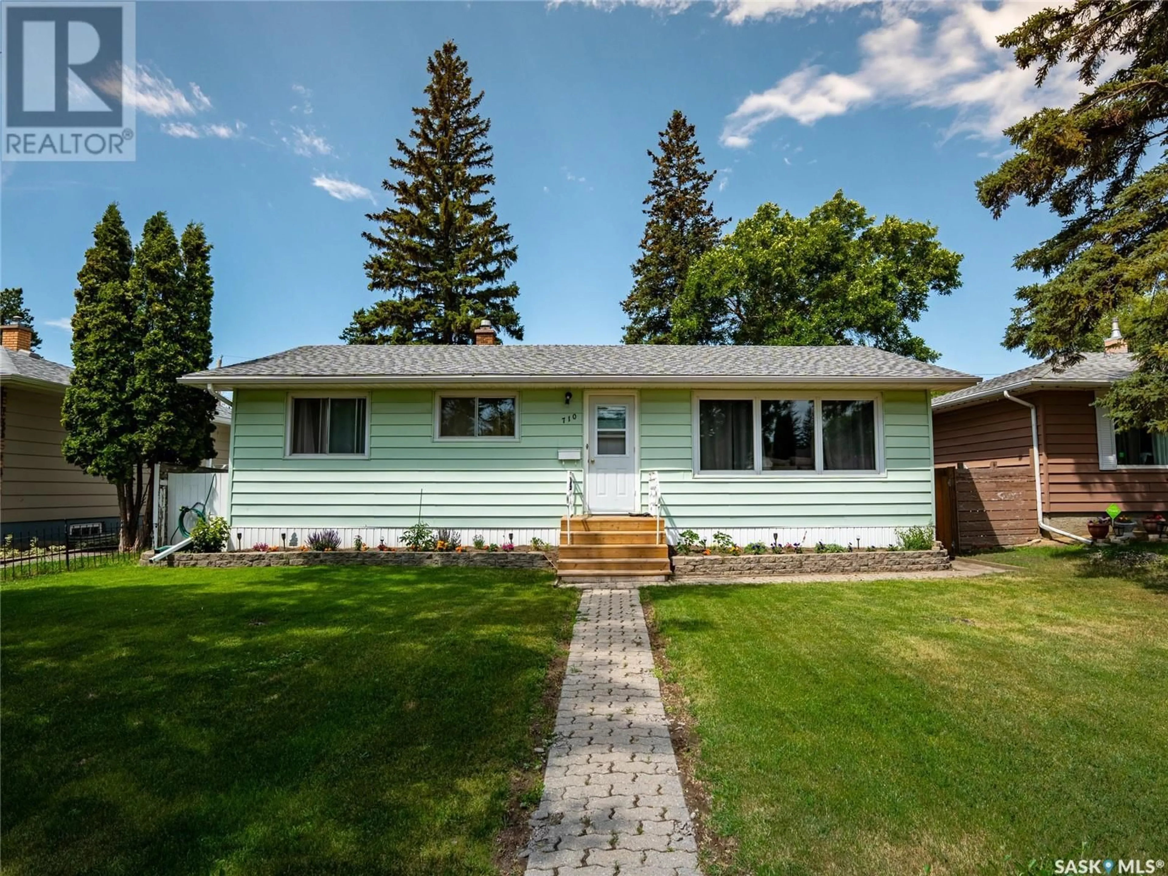Home with vinyl exterior material, street for 710 FORGET STREET, Regina Saskatchewan S4T4X2
