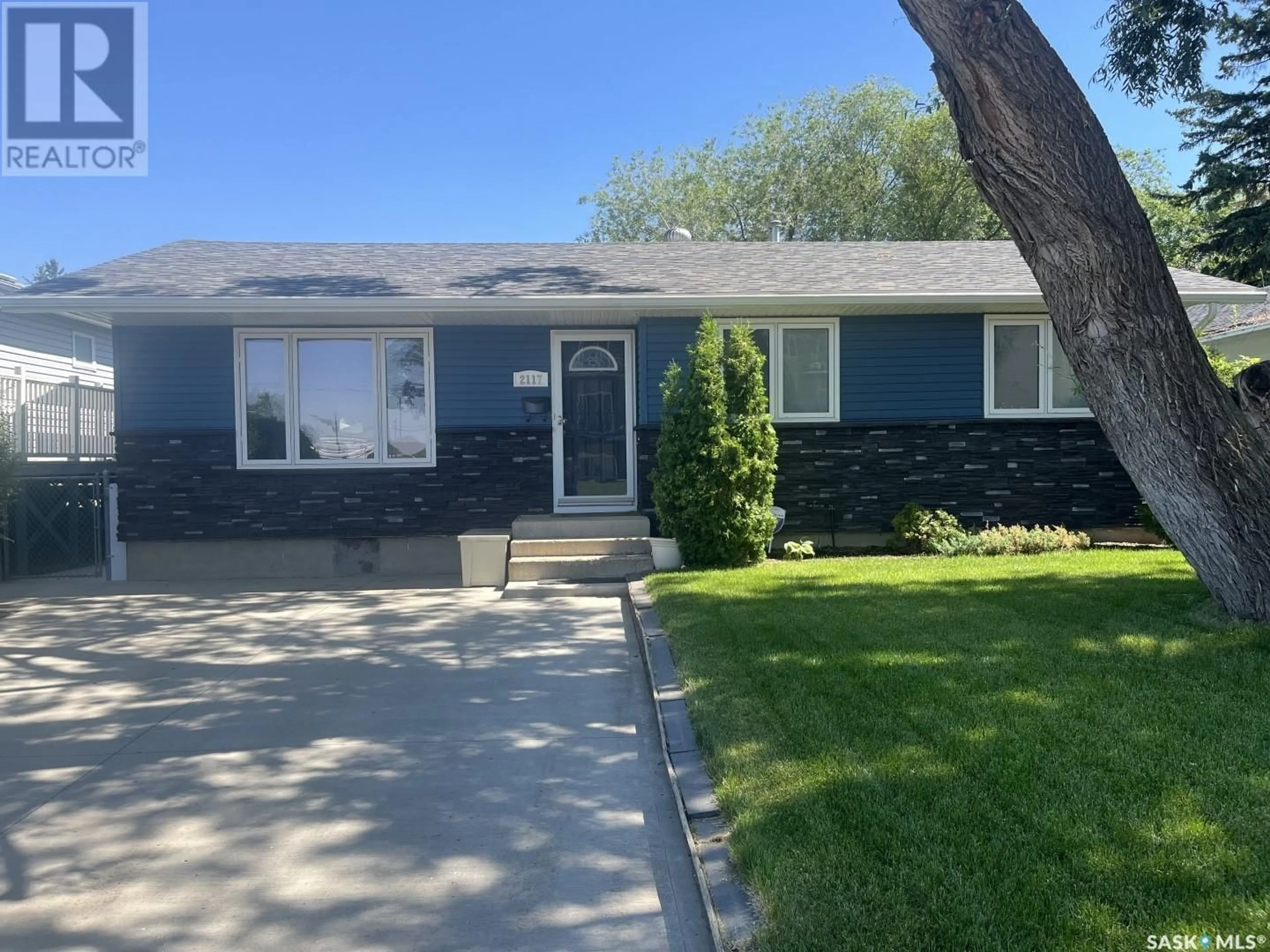 Home with vinyl exterior material, street for 2117 STE CECILIA AVENUE, Saskatoon Saskatchewan S7M0P3
