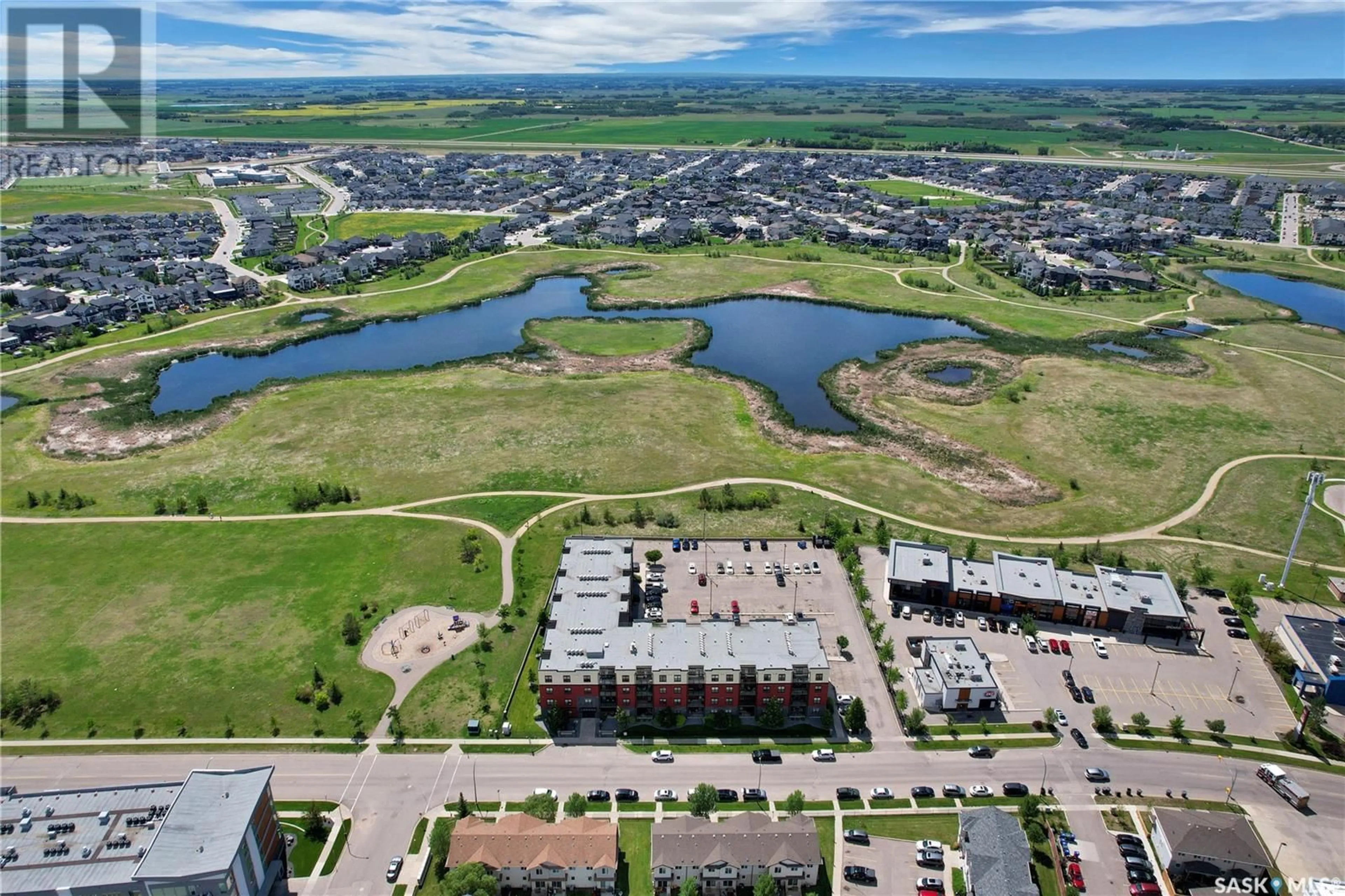 A pic from outside/outdoor area/front of a property/back of a property/a pic from drone, water/lake/river/ocean view for 230 - 303 SLIMMON ROAD, Saskatoon Saskatchewan S7V0B3