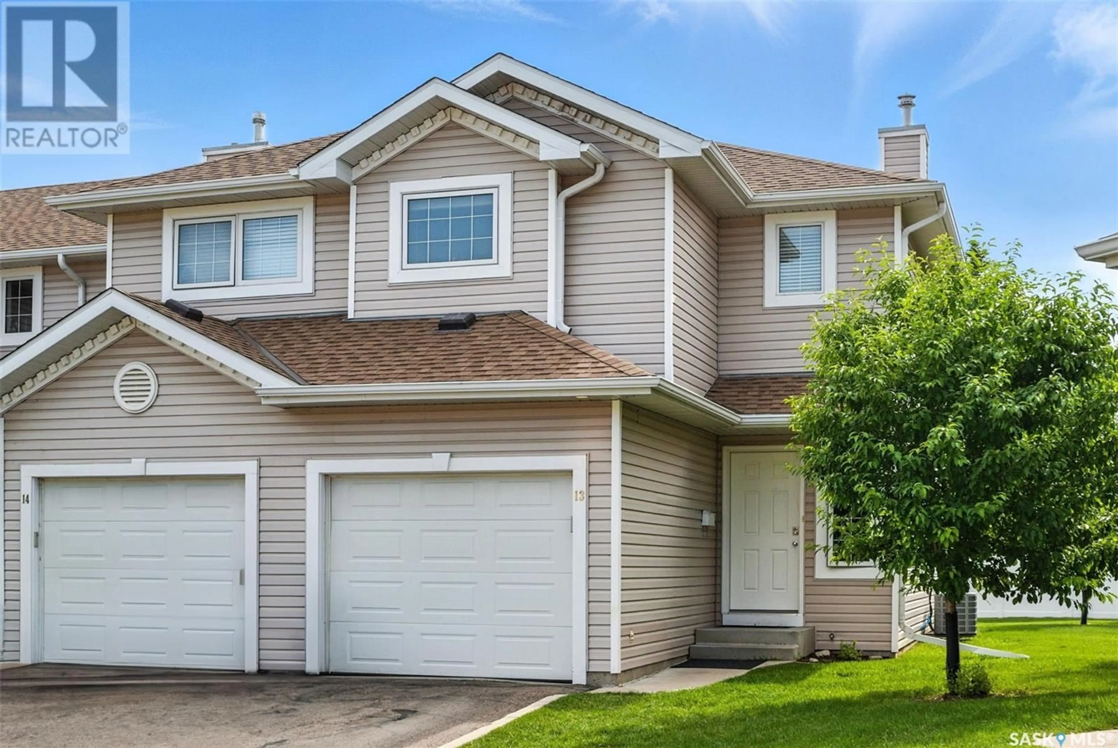 Home with vinyl exterior material, street for 13 215 PINEHOUSE DRIVE, Saskatoon Saskatchewan S7K6N9